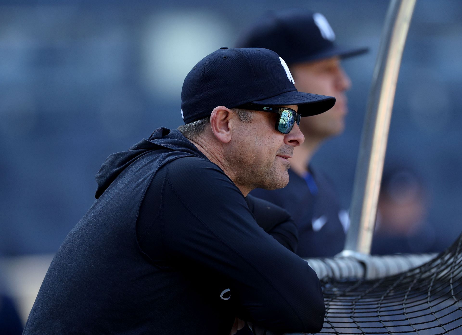 Manager Aaron Boone of the New York Yankees watches batting practice against the San Diego Padres at Yankee Stadium