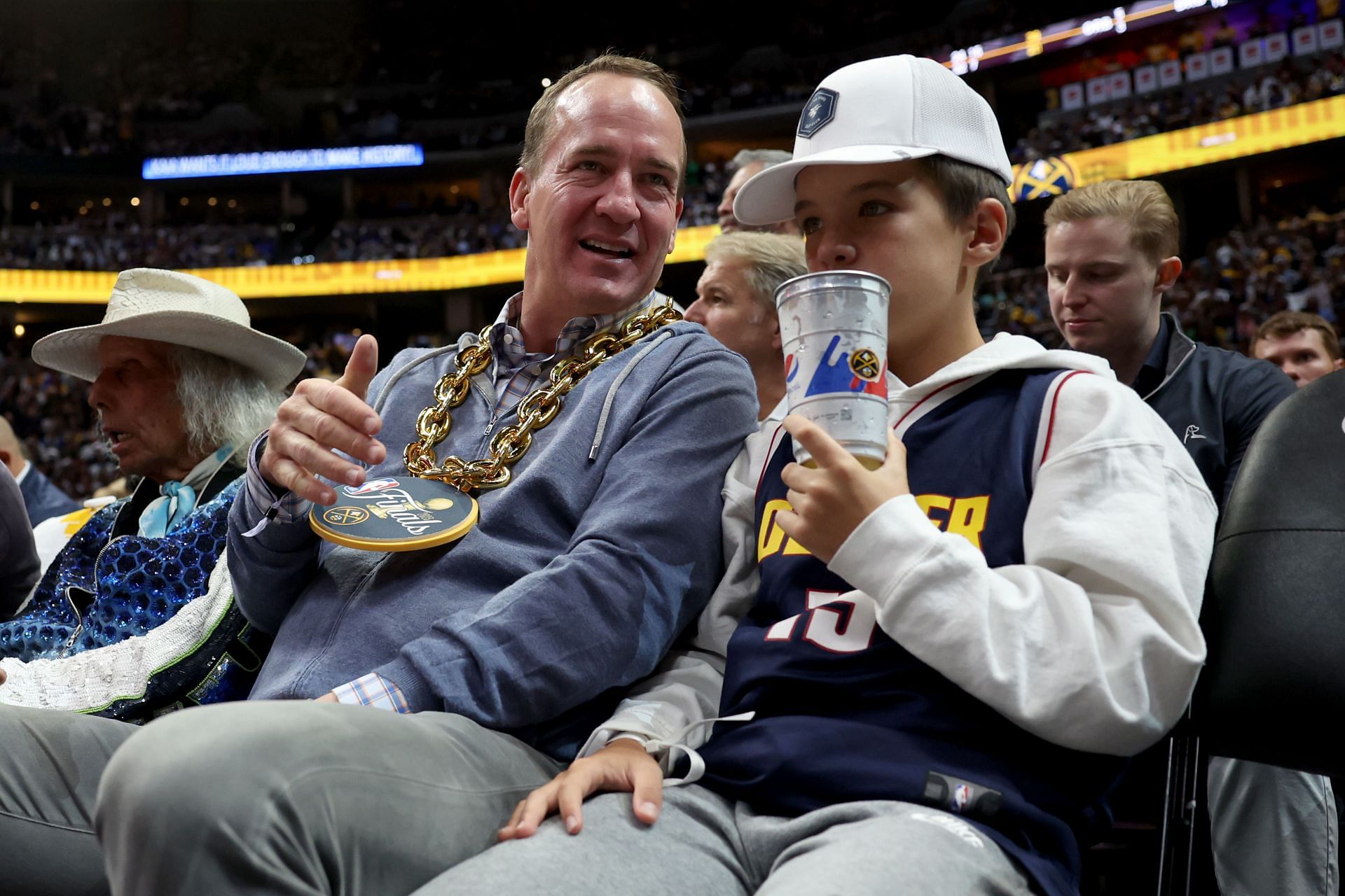 Broncos legend Peyton Manning celebrates Nuggets championship courtside