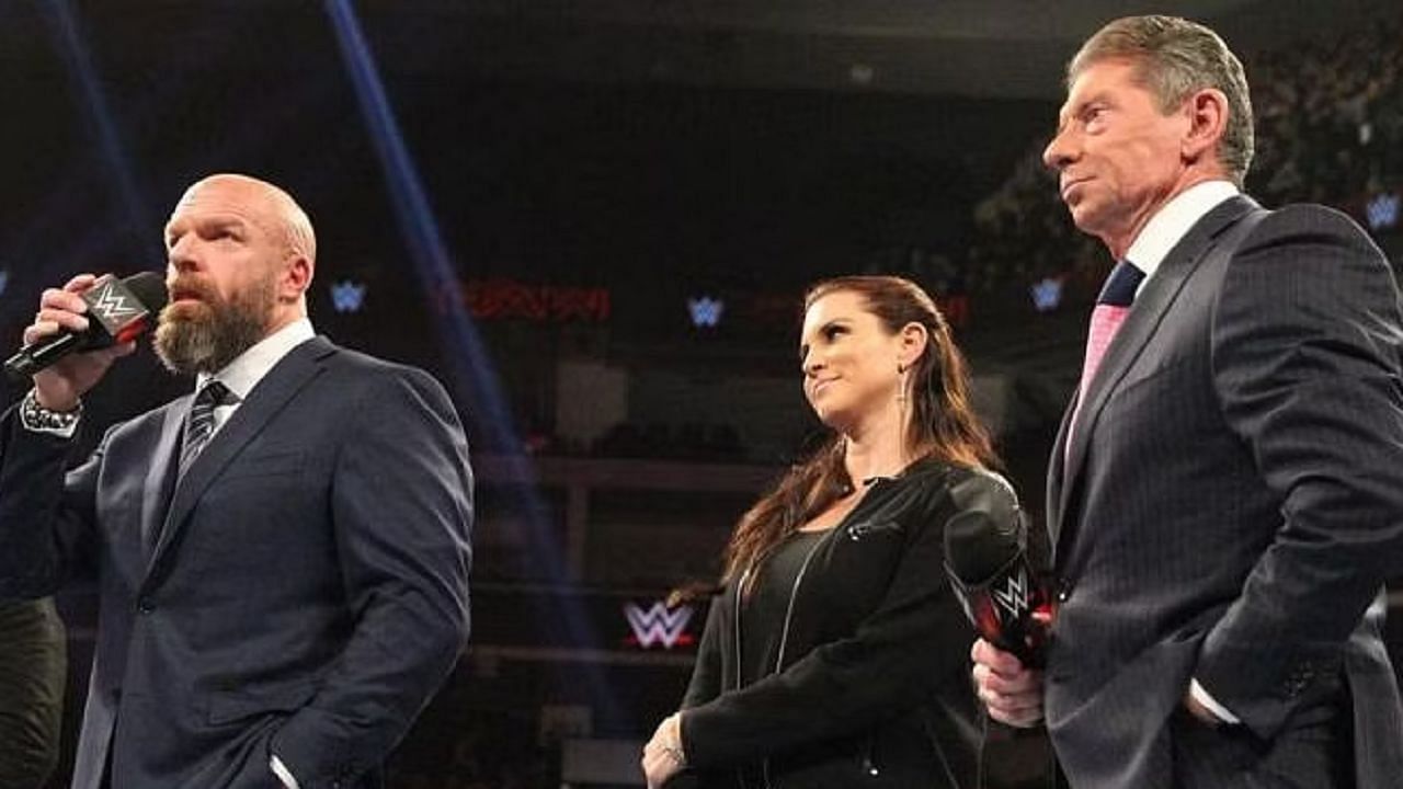 Triple H, Stephanie McMahon, and Vince McMahon -  the three WWE bigwigs