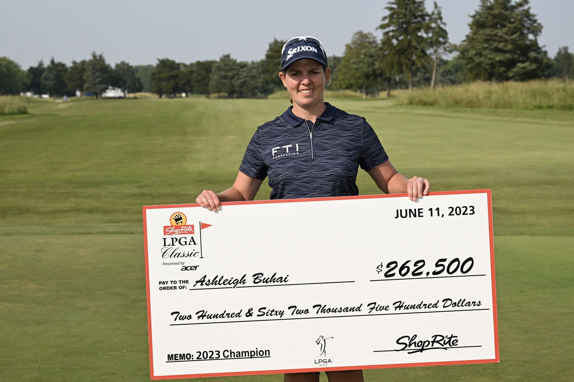 Ashleigh Buhai poses for a photo with a check after winning the ShopRite LPGA Classic 2023