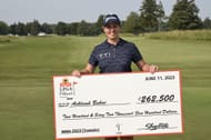Ashleigh Buhai poses for a photo with a check after winning the ShopRite LPGA Classic 2023