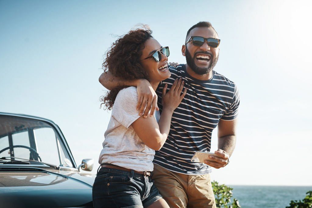 Shot of a young couple enjoying a summer&rsquo;s road trip together(Image via Getty Images)