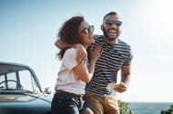 Shot of a young couple enjoying a summer’s road trip together(Image via Getty Images)