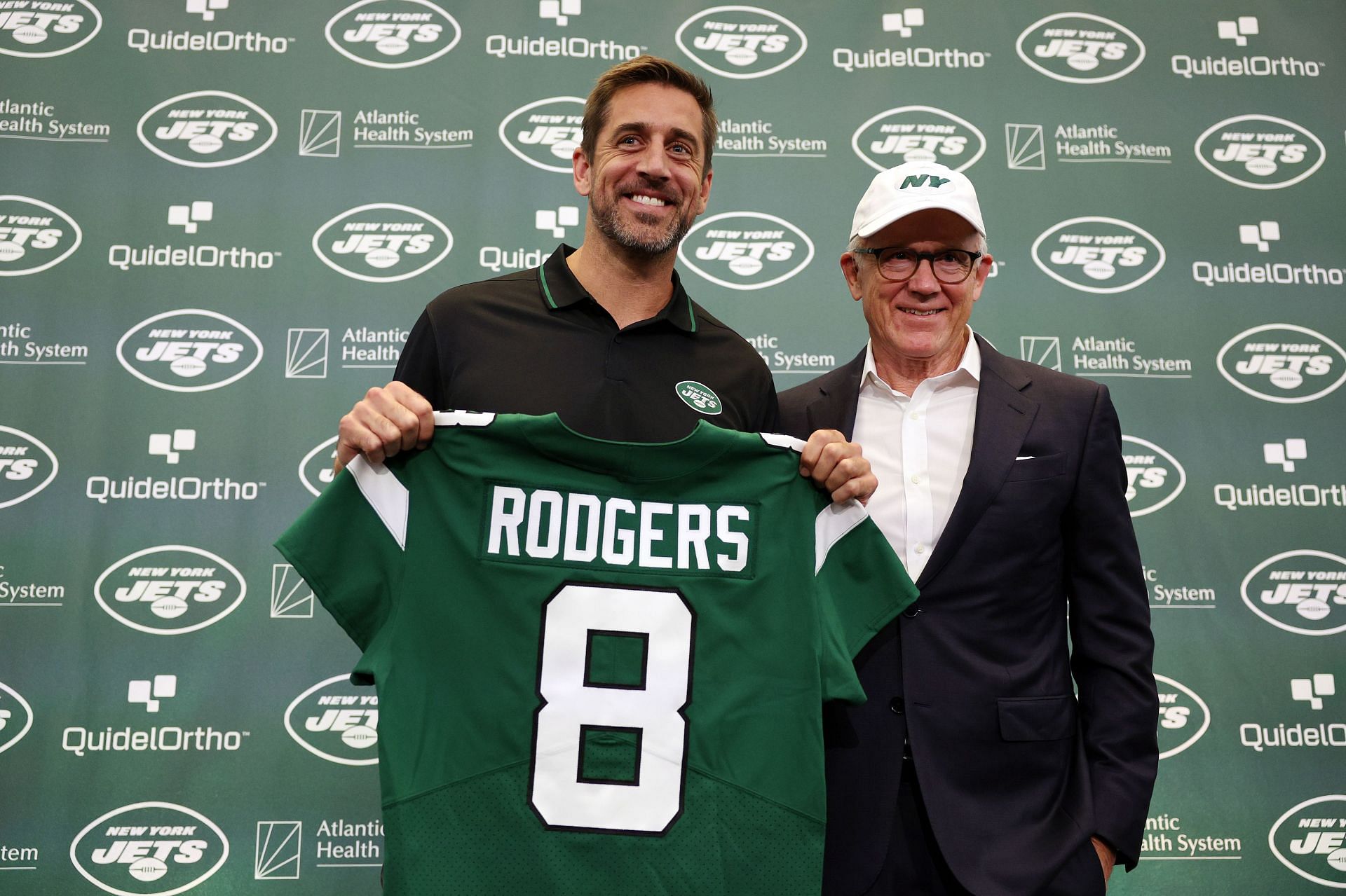 Aaron Rodgers with Jets owner Woody Johnson