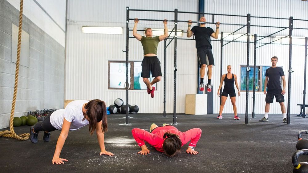 To facilitate the pull-up portion, you have the option to initiate with assisted pull-ups or utilize resistance bands for assistance. (Image via coachweb.com)