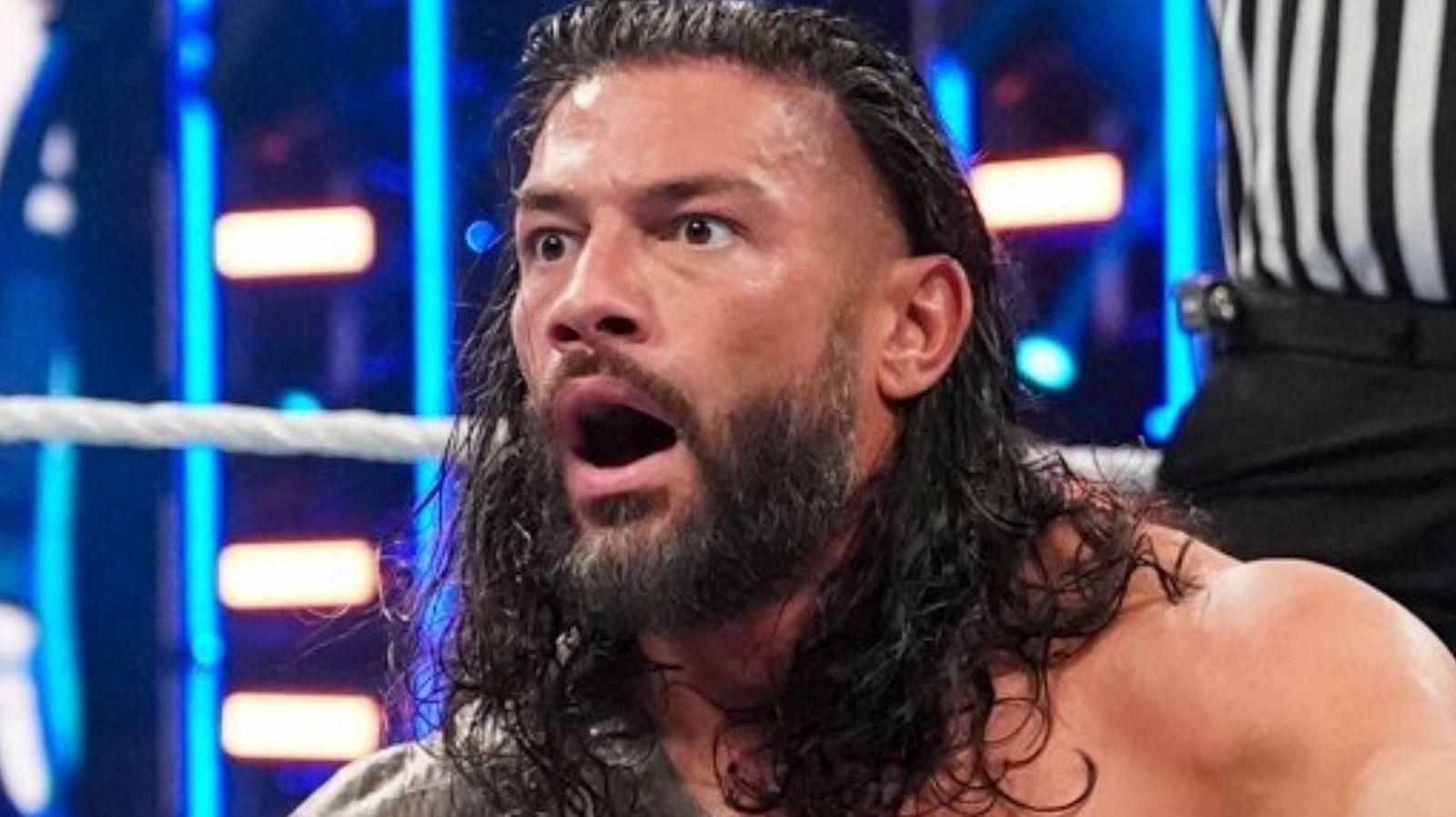 Roman Reigns looks stunned during a match. 