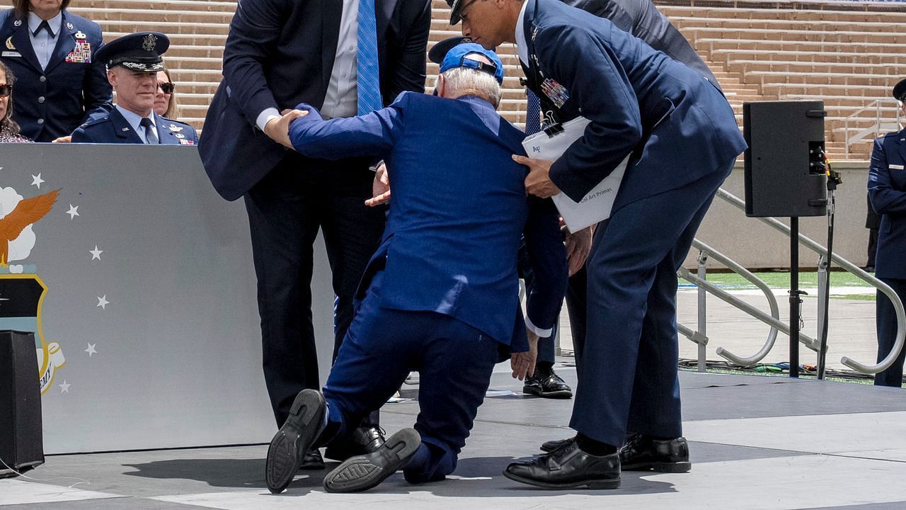 Social media users share hilarious reactions as President Biden tumbles on the stage during a graduation ceremony. (Image via Getty Images)