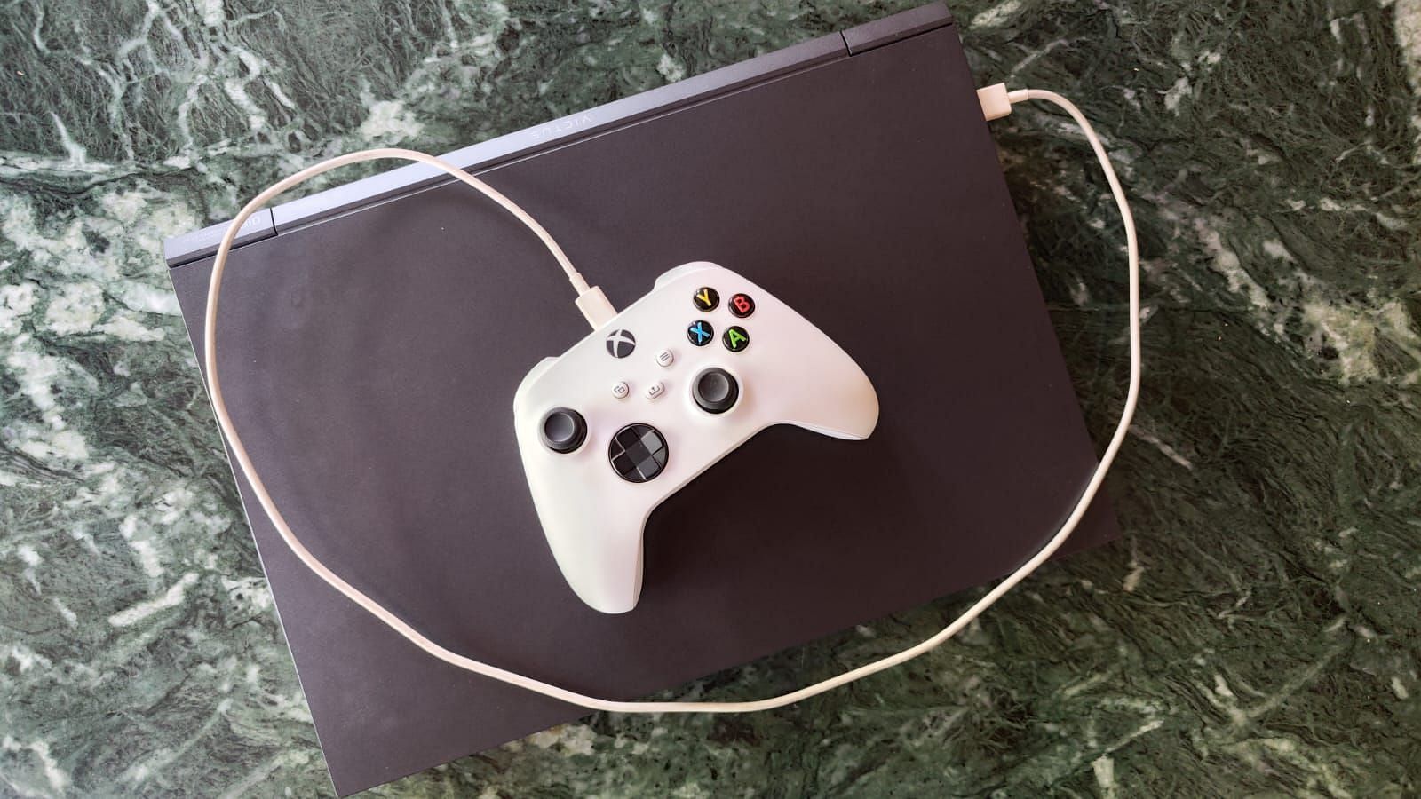 Connect the Xbox controller via a USB cable to your PC (Image via Sportskeeda)