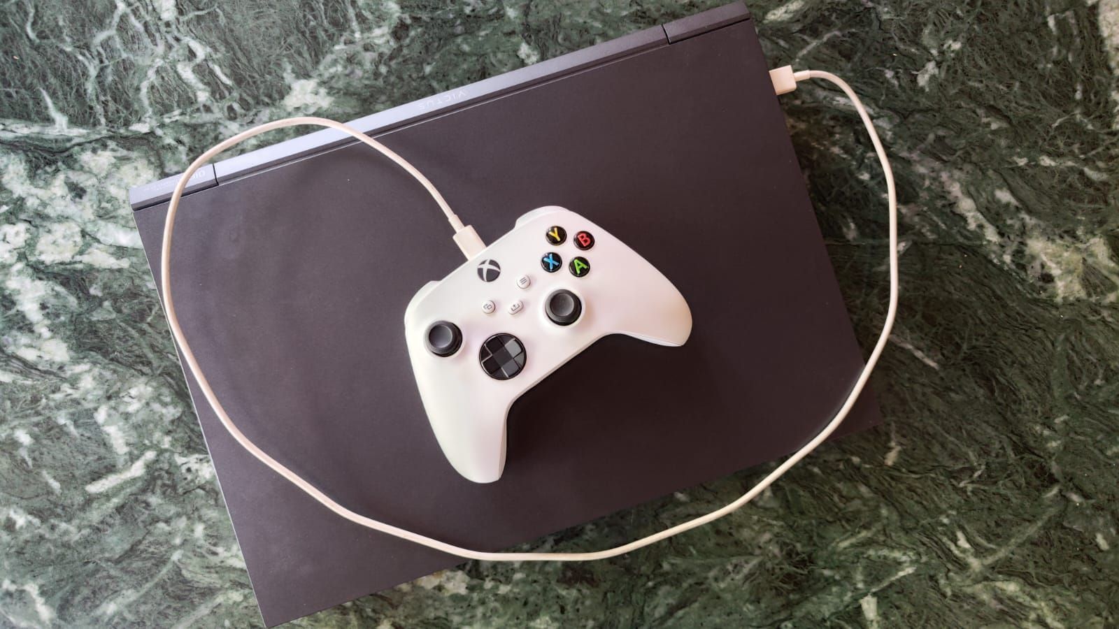 Connect the Xbox controller via a USB cable to your PC (Image via Sportskeeda)