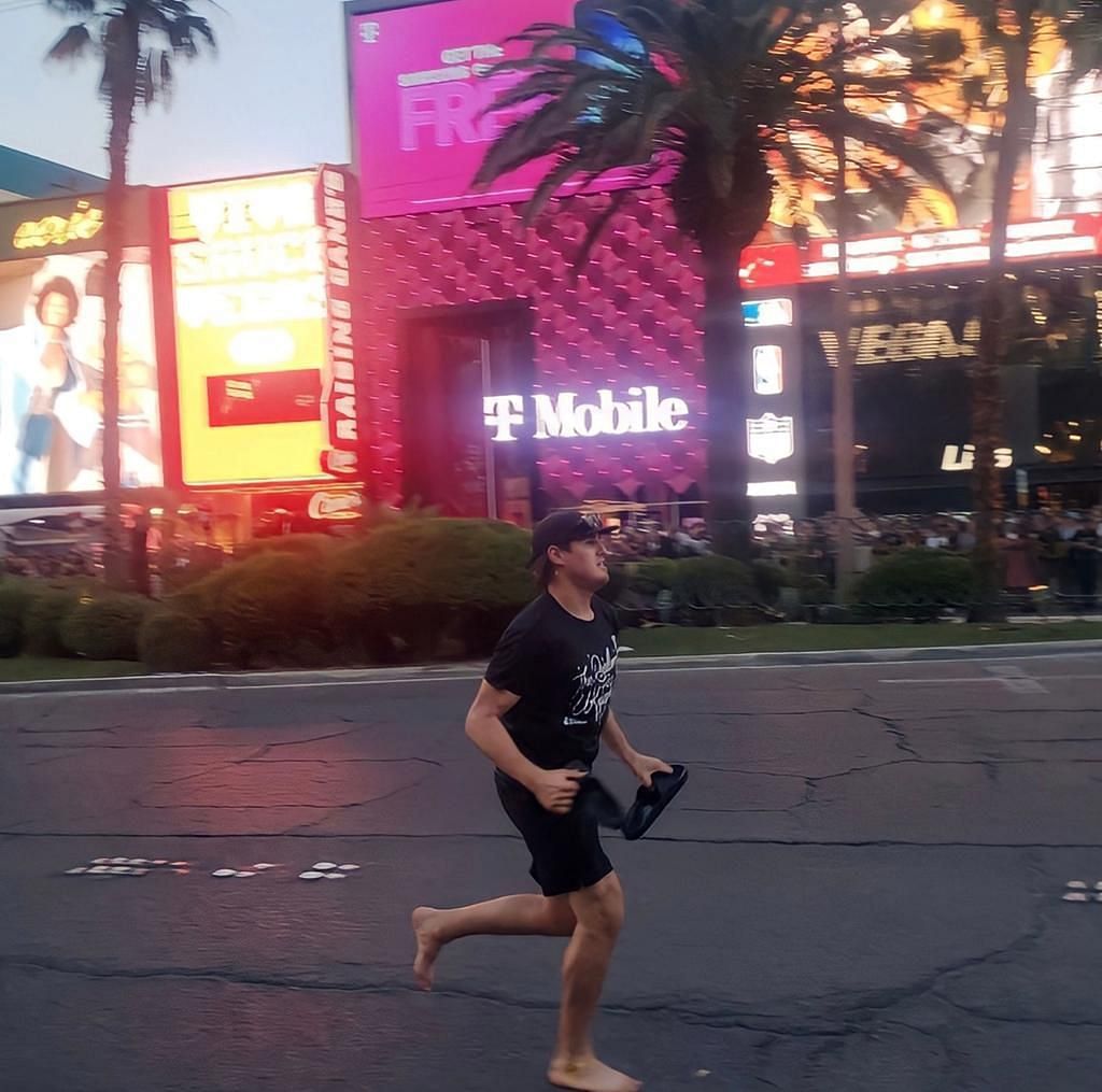 Zach Whitecloud runs down the Vegas strip with no shoes in bizarre moment