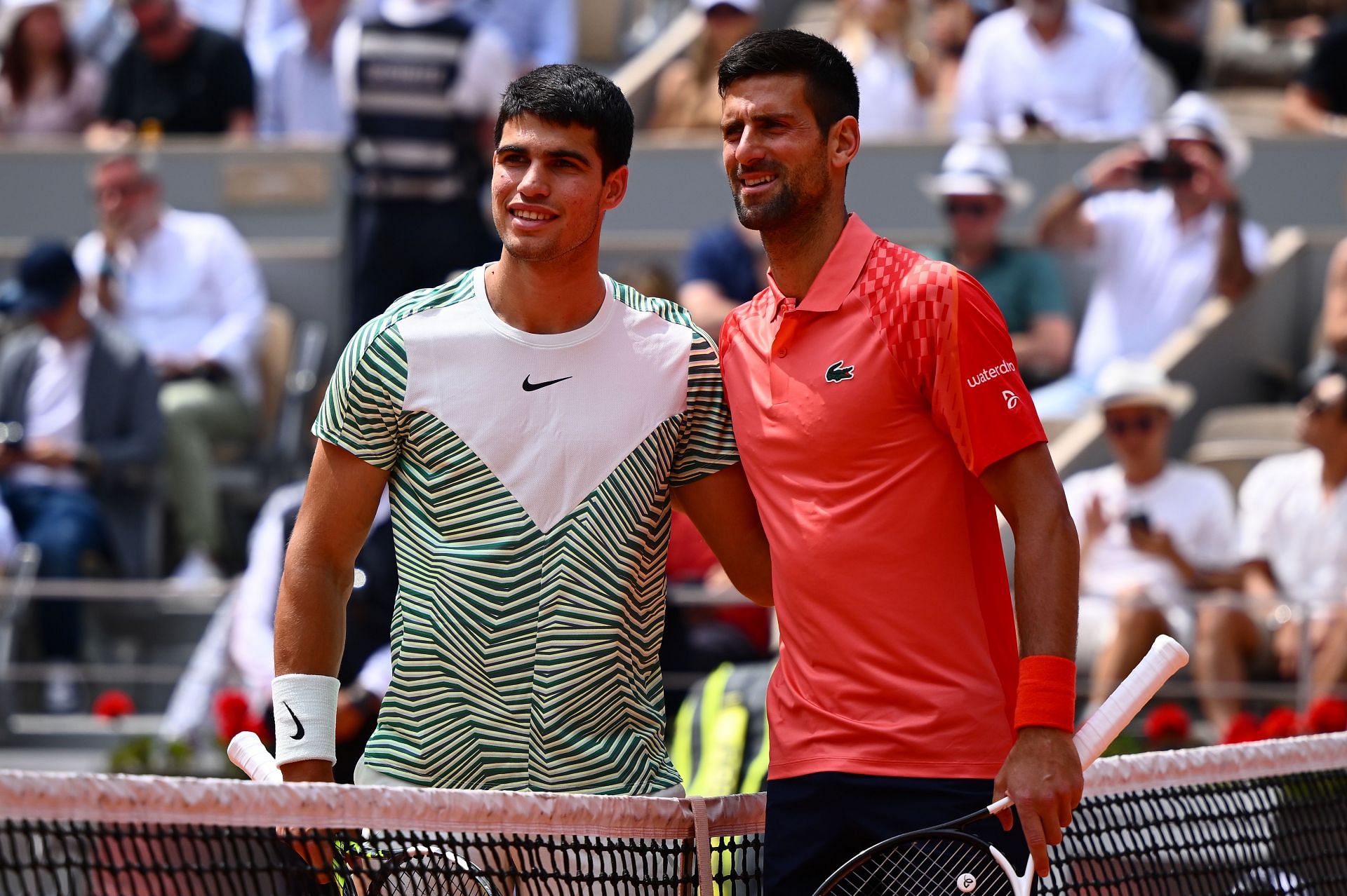 Carlos Alcaraz and Novak Djokovic during their 2023 French Open SF