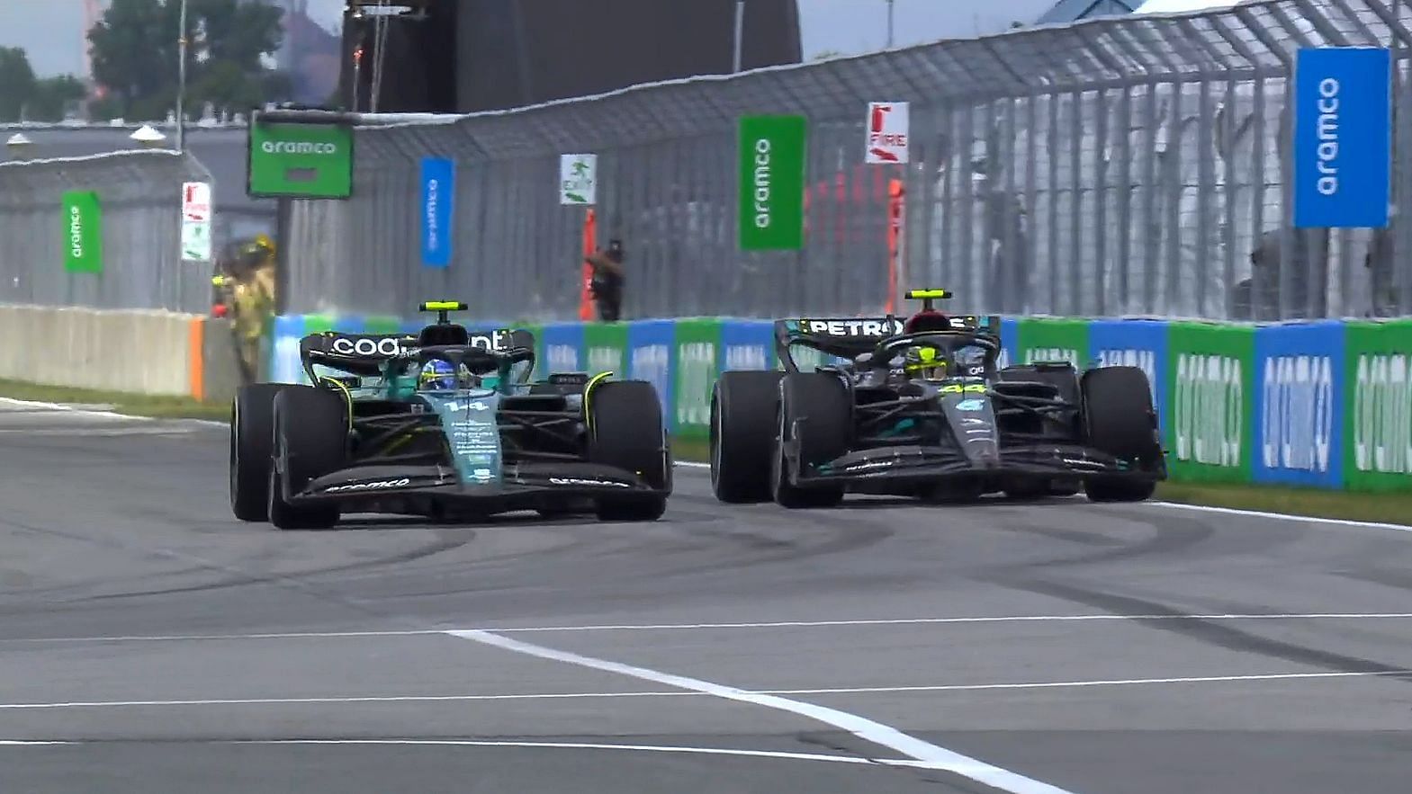 Fernando Alonso (14) and Lewis Hamilton (44) on track during the 2023 F1 Canadian Grand Prix. (Photo by Sportskeeda)