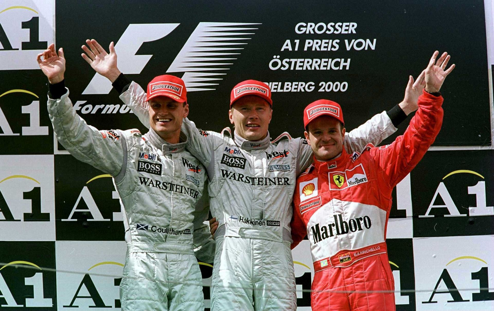 Mika Hakkinen, David Coulthard (of McLaren), and Rubens Barrichello (of Ferrari) on the podium of the 2000 F1 Austrian GP (Credits - Mark Thompson/ALLSPORT)