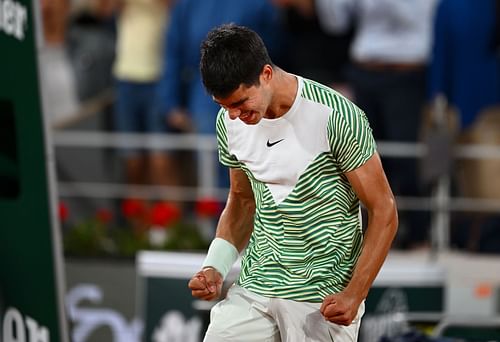 Carlos Alcaraz celebrates winning his quarterfinal against Stefanos Tsitsipas