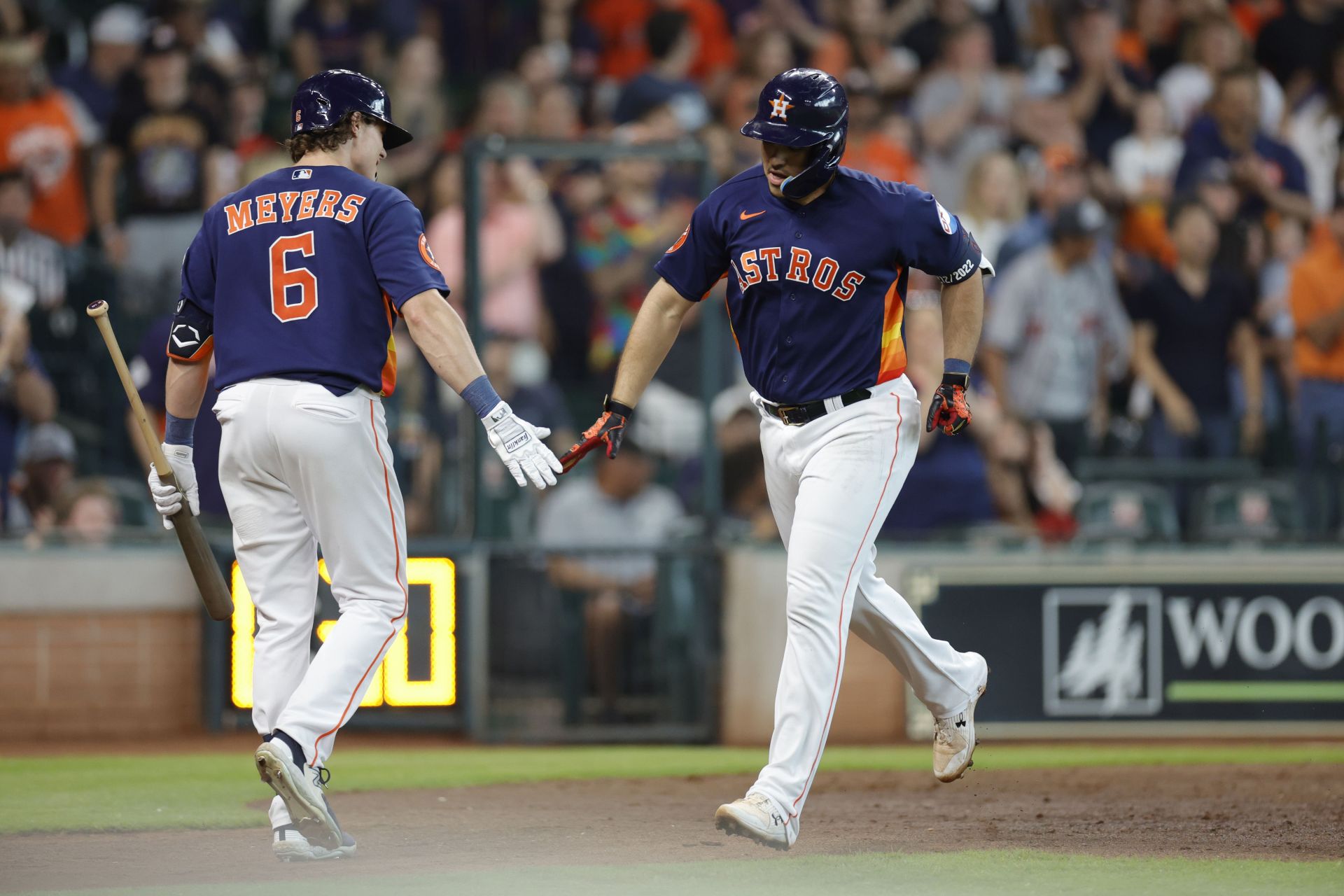 Yainer Diaz #21 of the Houston Astros high fives Jake Meyers #6 after hitting a solo home run