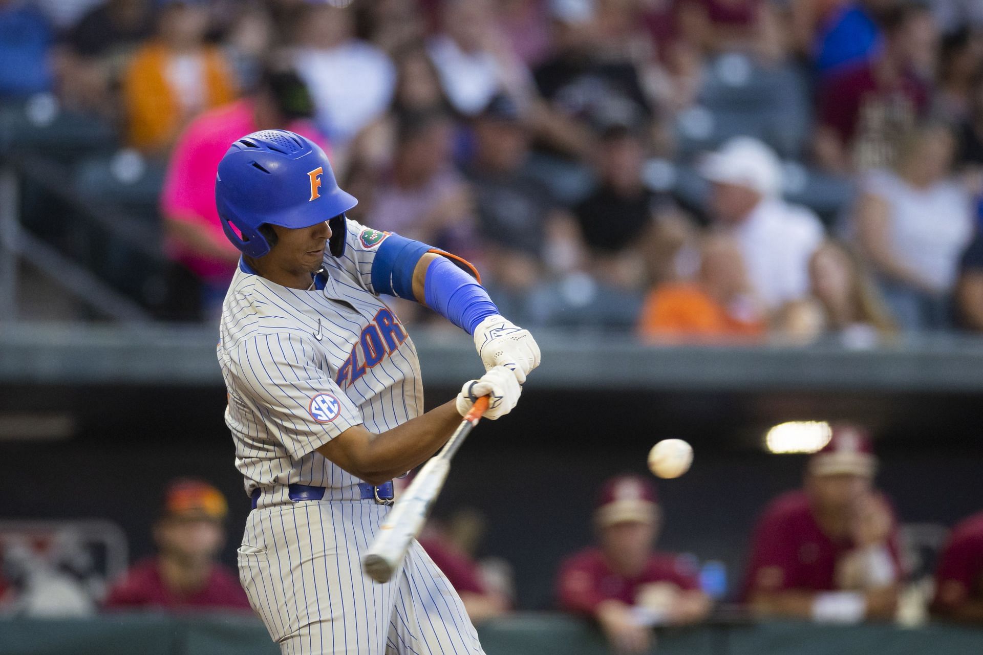 Florida infielder Josh Rivera (24) celebrates while running to