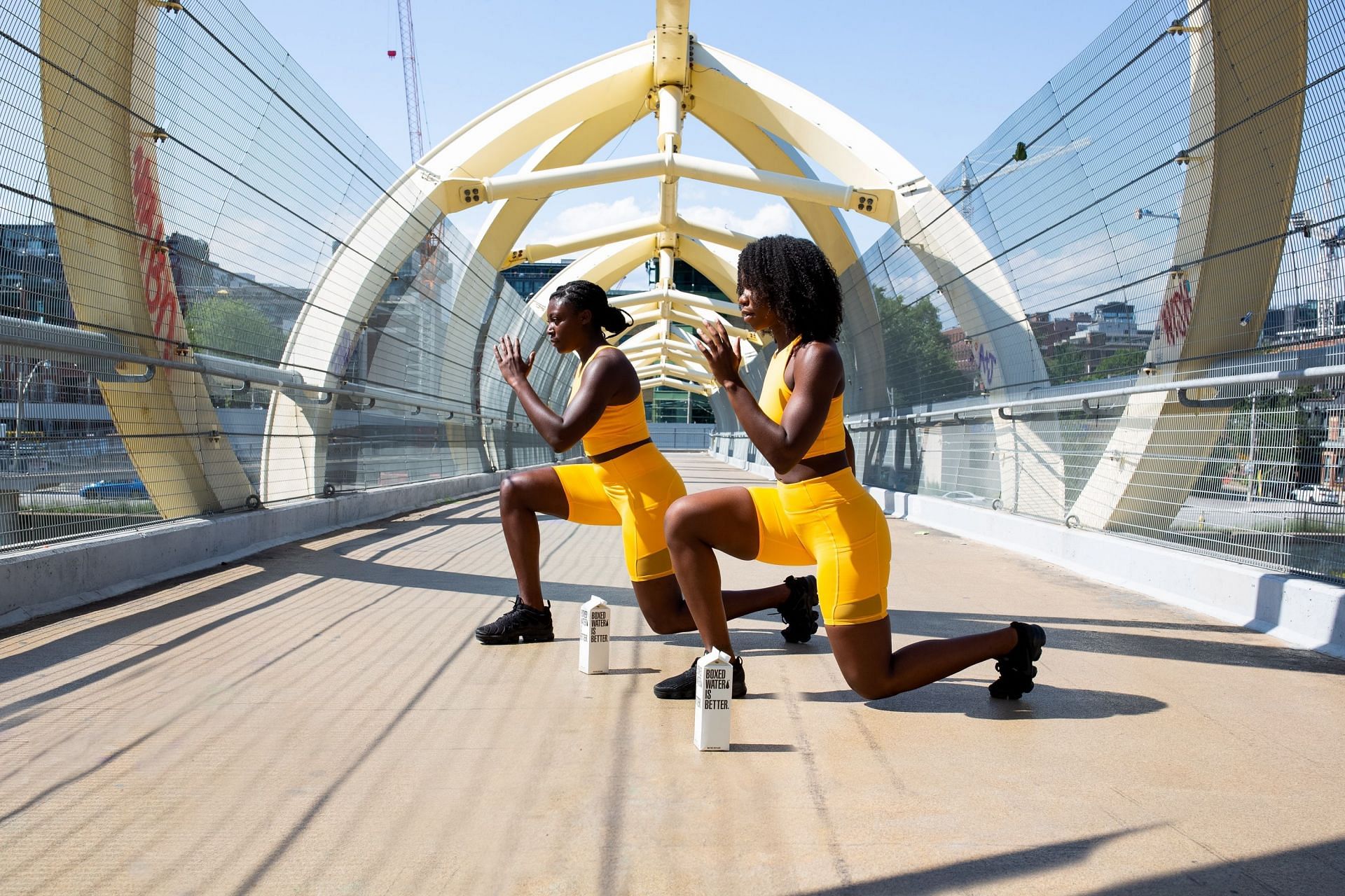 Work out with a buddy or a partner, (Image via Unsplash/Boxed water is better)