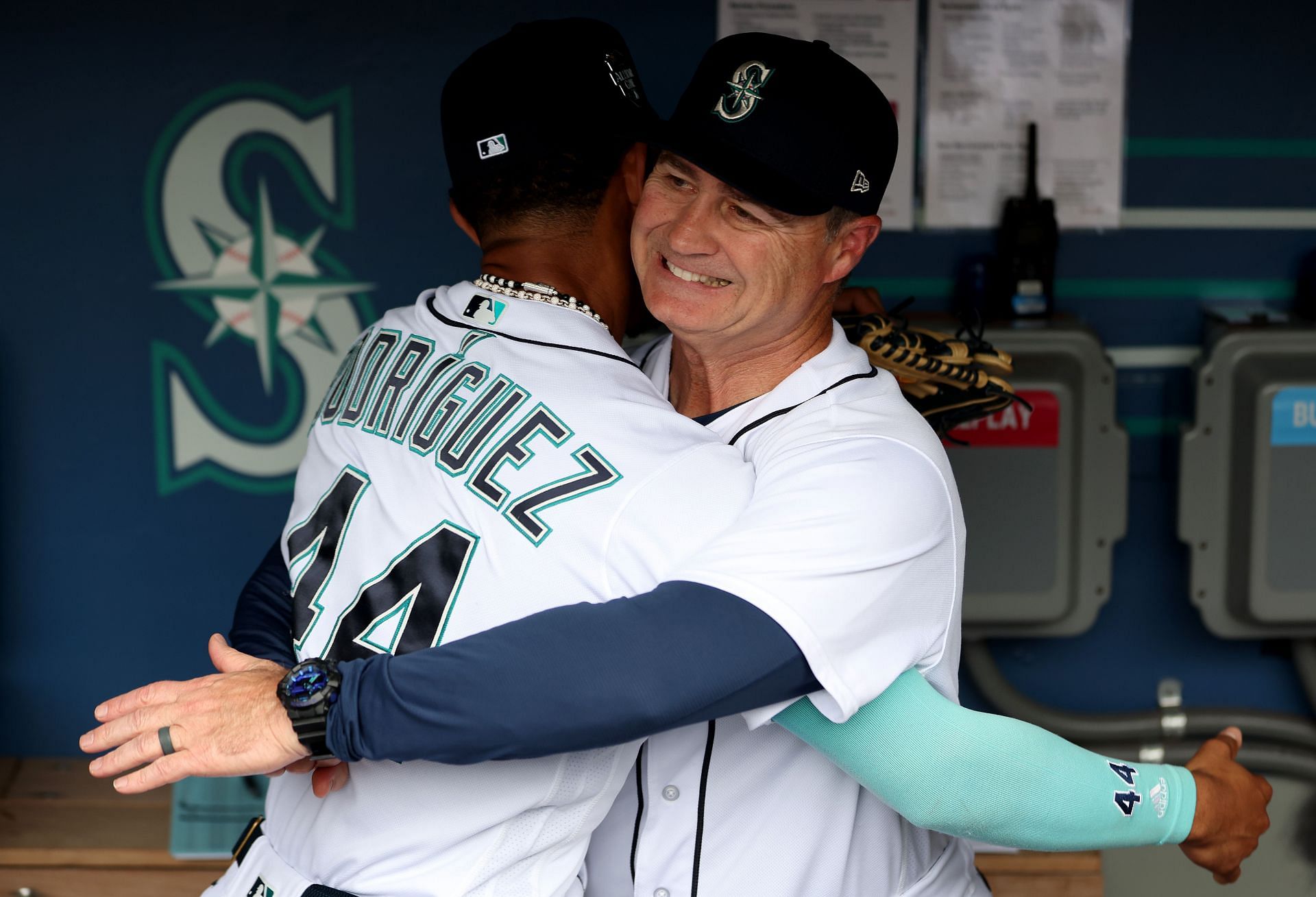 Manager Scott Servais #9 hugs and lifts Julio Rodriguez #44 of the Seattle Mariners
