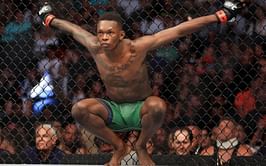 Israel Adesanya reacts to teen caught up in shark-infested waters following a dare