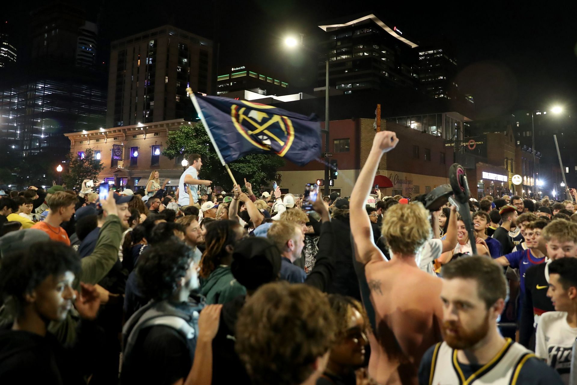 Denver Nuggets fans celebrate in downtown Denver after the end of Game Five of the 2023 NBA Finals