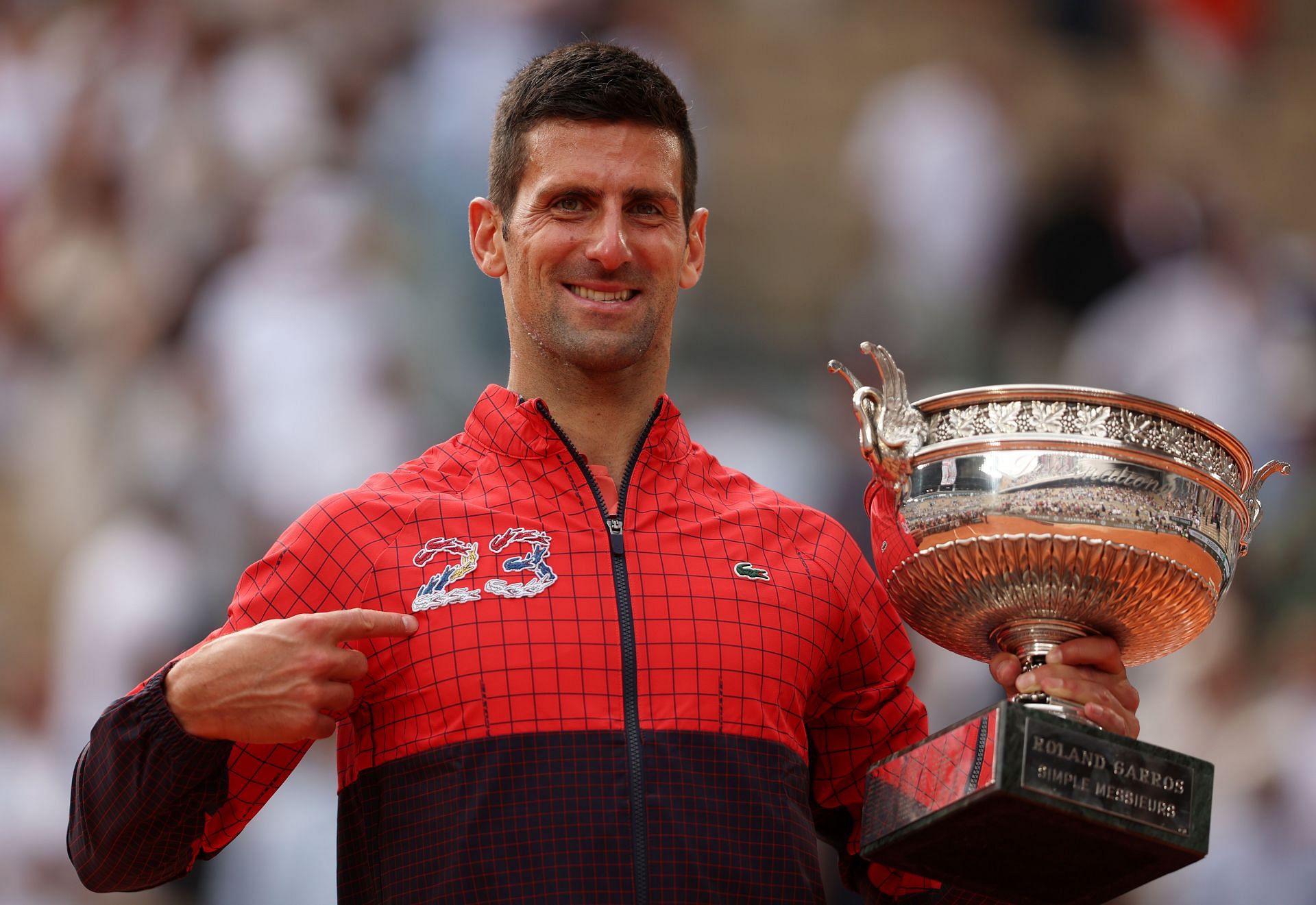 Djokovic poses with the trophy