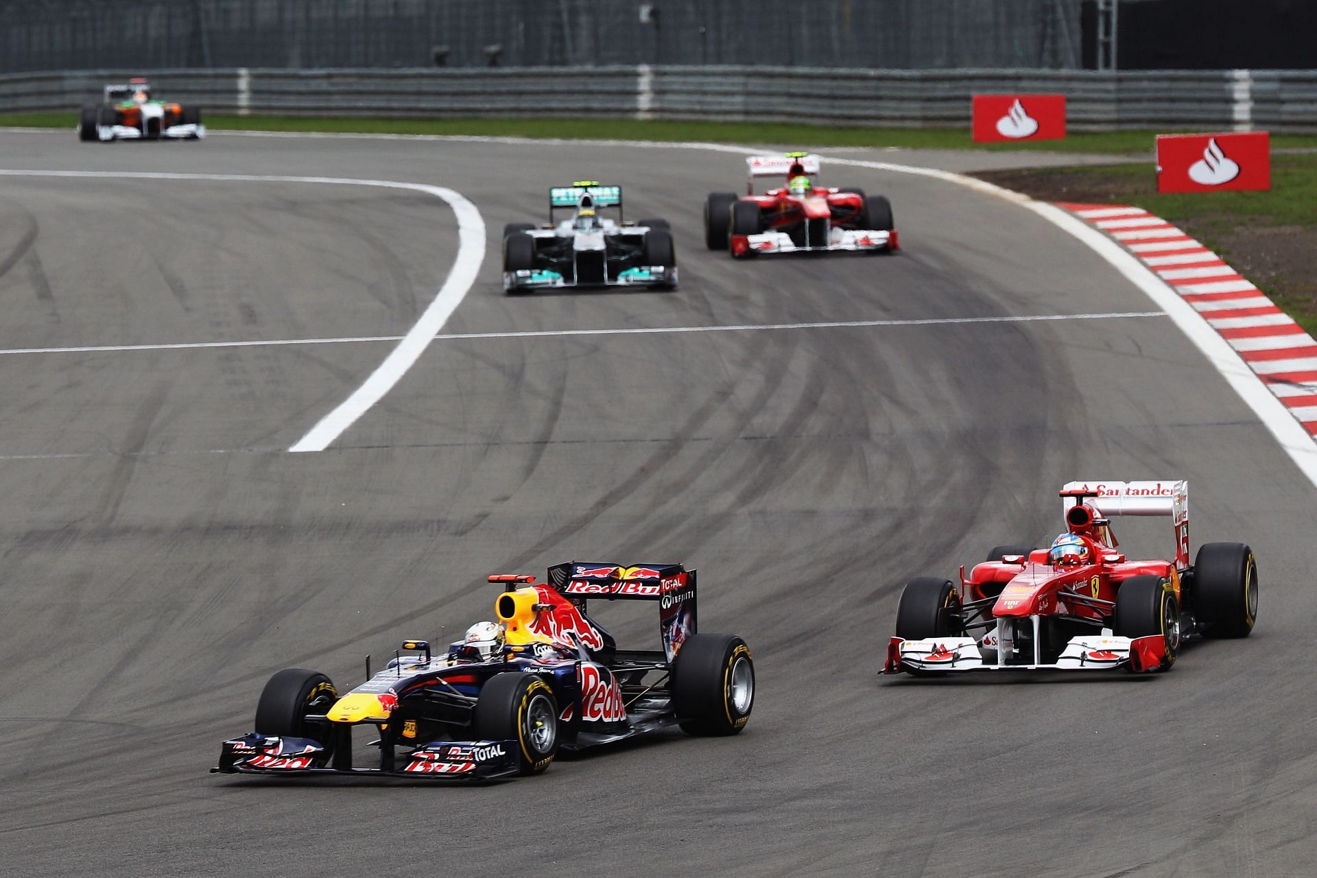Fernando Alonso and Sebastian Vettel during the 2011 GP of Germany (Photo by Mark Thompson/Getty Images)