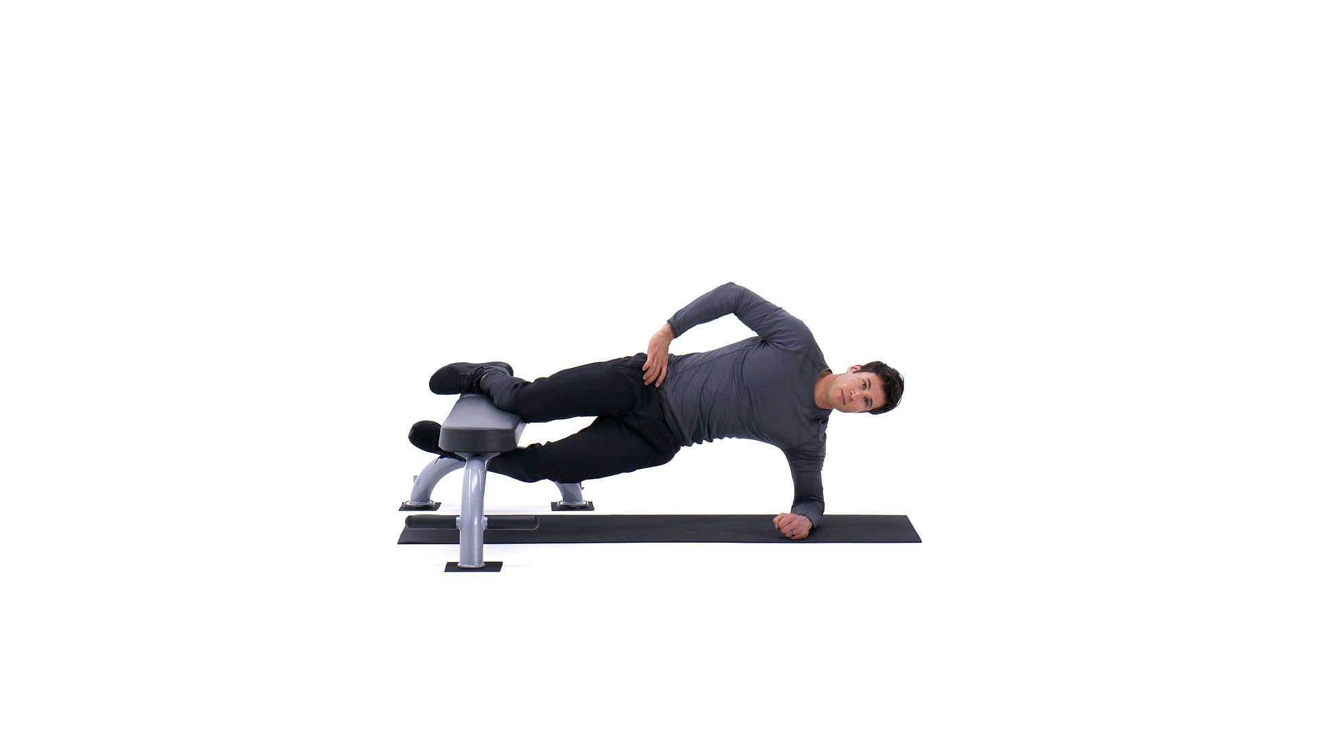 The main focus of this Plank exercise is on the core muscles, which encompass the rectus abdominis, transverse abdominis, obliques, and the muscles in the lower back. (Image via Bodybuilding,com)