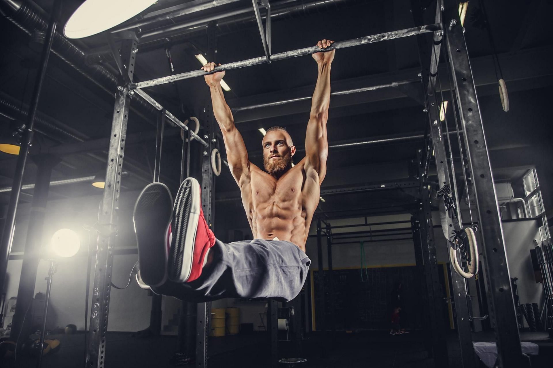 Hanging leg raises. (Image via Freepik)