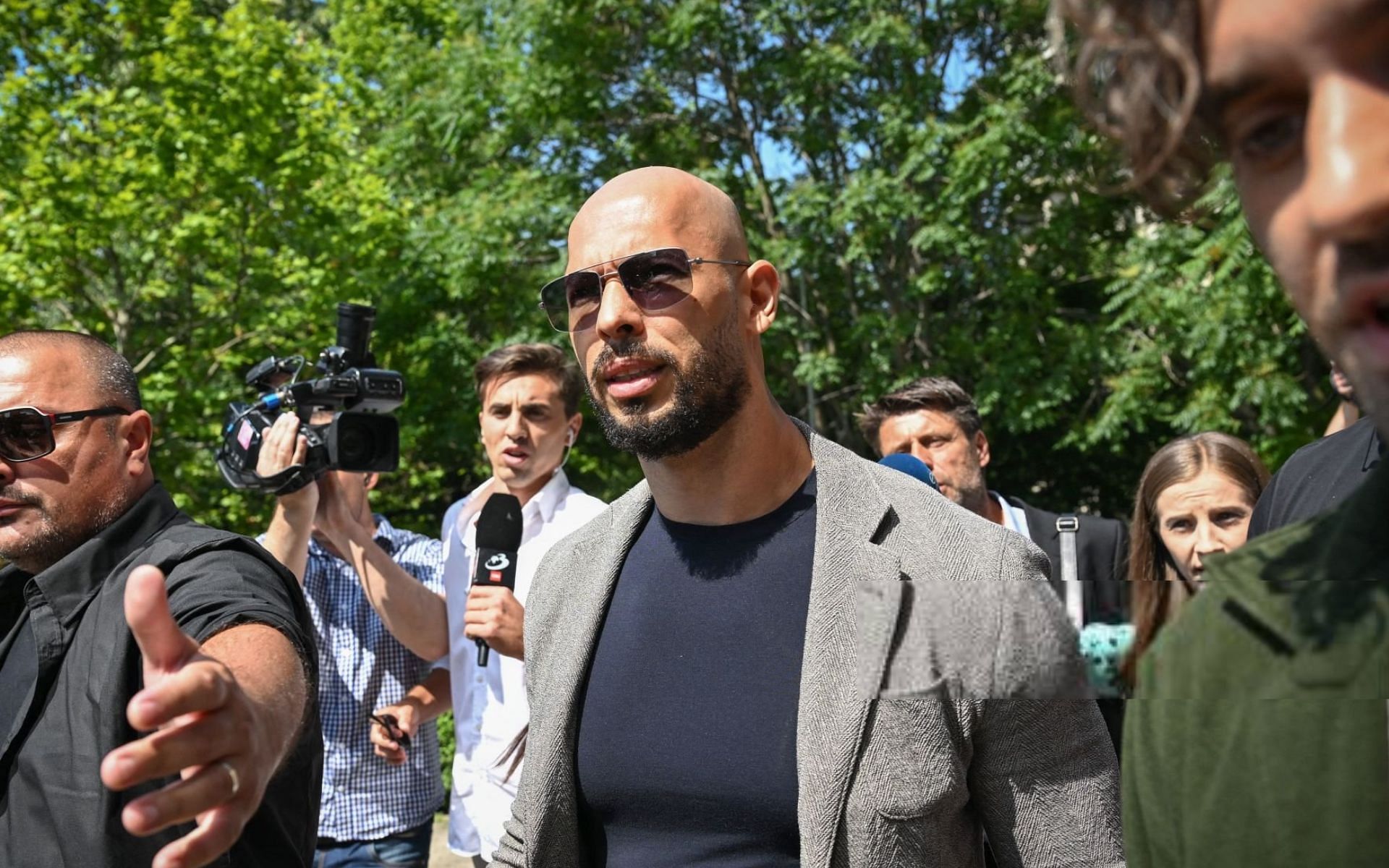 Andrew Tate leaving court in Romania [Image Courtesy: @GettyImages]