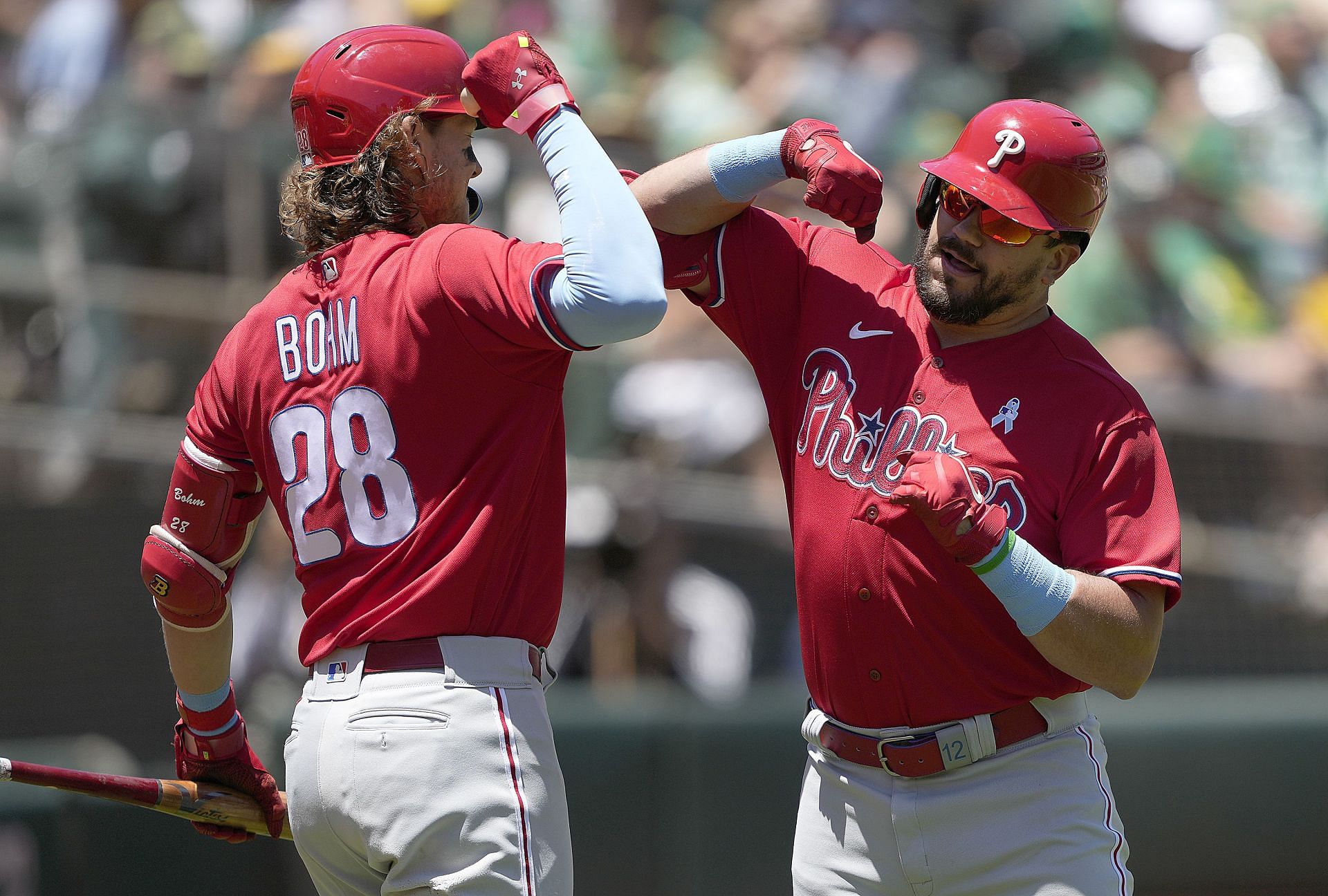 Kyle Schwarber and Alec Bohm of the Philadelphia Phillies celebrate.