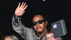 Lewis Hamilton attends Glastonbury festival with David Furnish and his sons