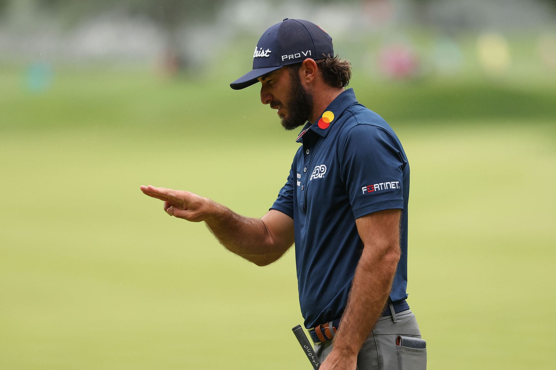 Max Homa lines up the putt during the Travelers Championship, Round Two