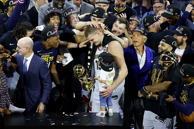 Watch: Nikola Jokic celebrates with the Larry O'Brien Trophy and the Bill Russell Trophy alongside his brothers