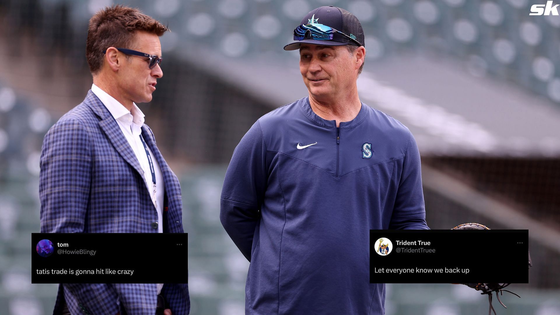 President of baseball operations Jerry Dipoto speaks with manager Scott Servais of the Seattle Mariners during Opening Day