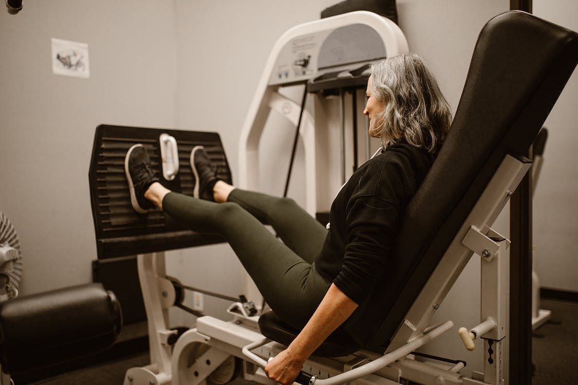 To introduce variety and challenge to your hamstring training, try performing the lying dumbbell leg curl with a single leg instead of using both legs simultaneously. (RDNE Stock project/ Pexels)