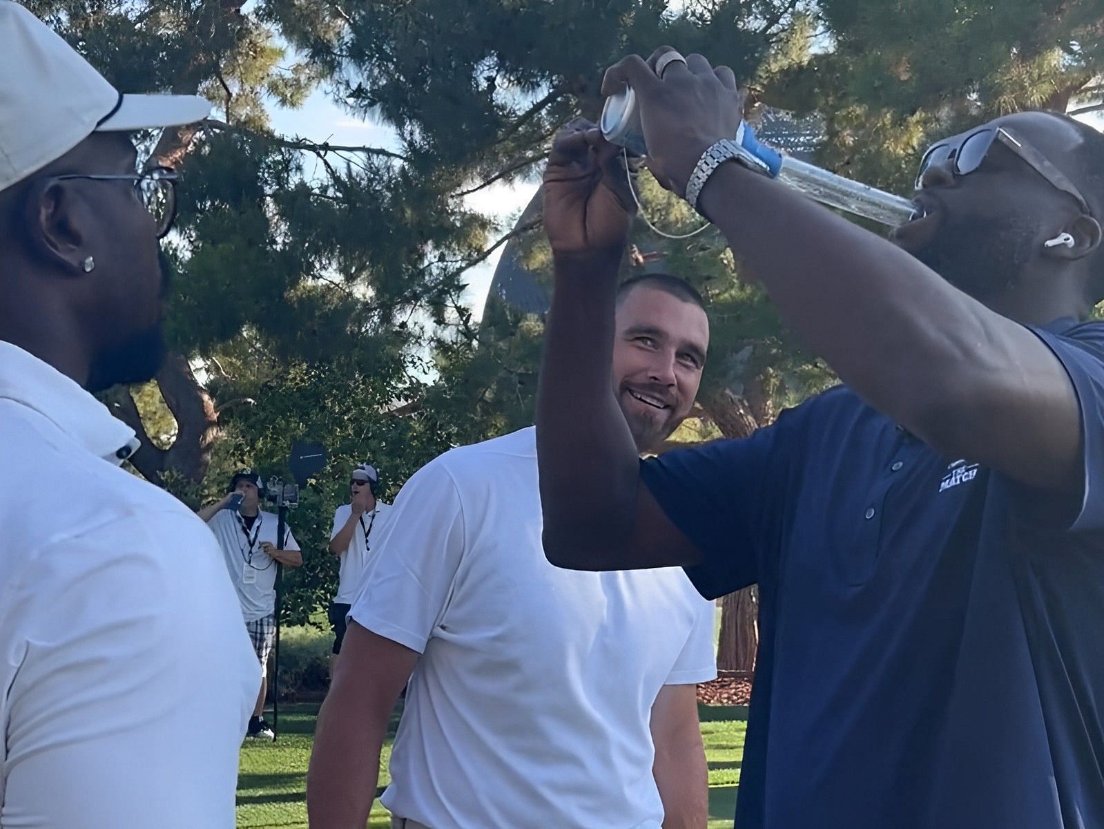 Golden State Warriors forward Draymond Green attempting to chug a beer during Capital One&rsquo;s &ldquo;The Match&rdquo; on Thursday night.