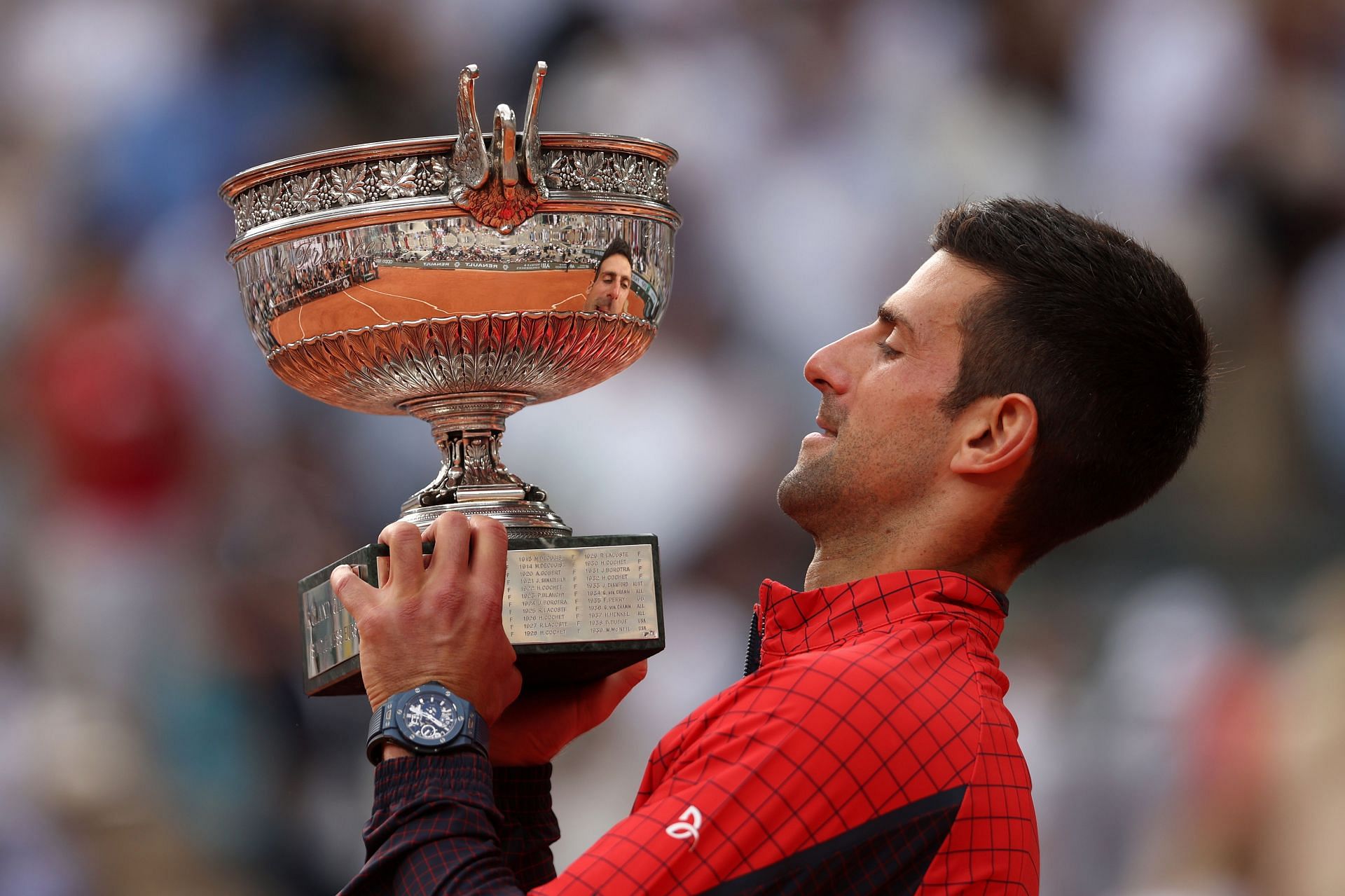 Djokovic lifts his third French Open title.