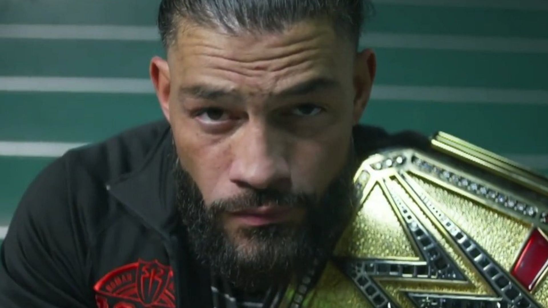 Roman Reigns poses with the new Undisputed WWE Universal Championship belt.