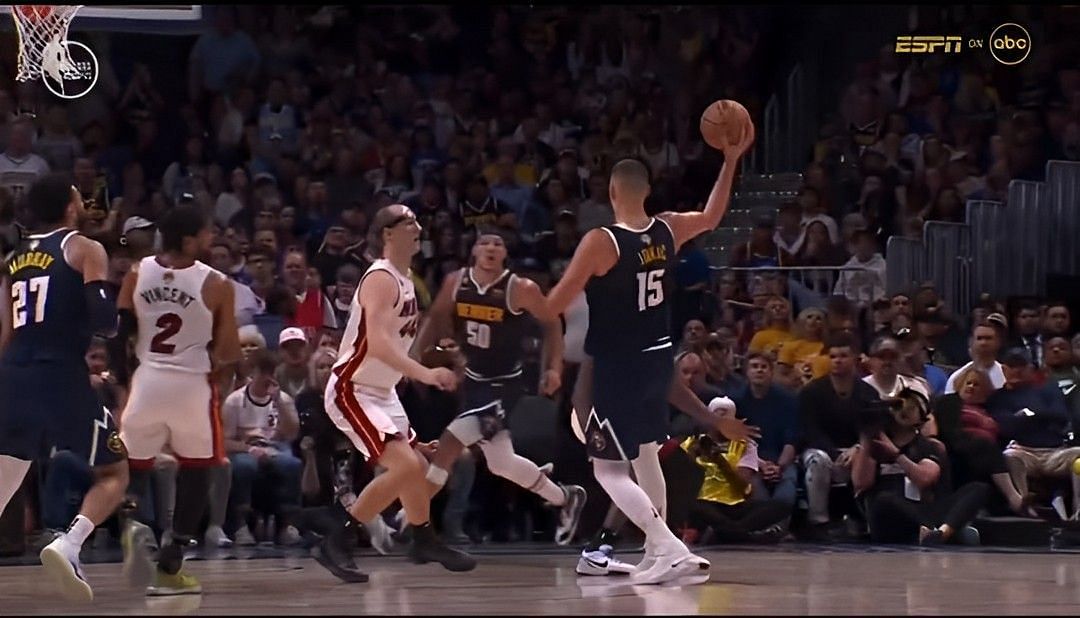 Denver Nuggets superstar center Nikola Jokic throwing a pass to teammate Aaron Gordon during the second quarter of Game 2 of the NBA Finals between the Denver Nuggets and Miami Heat