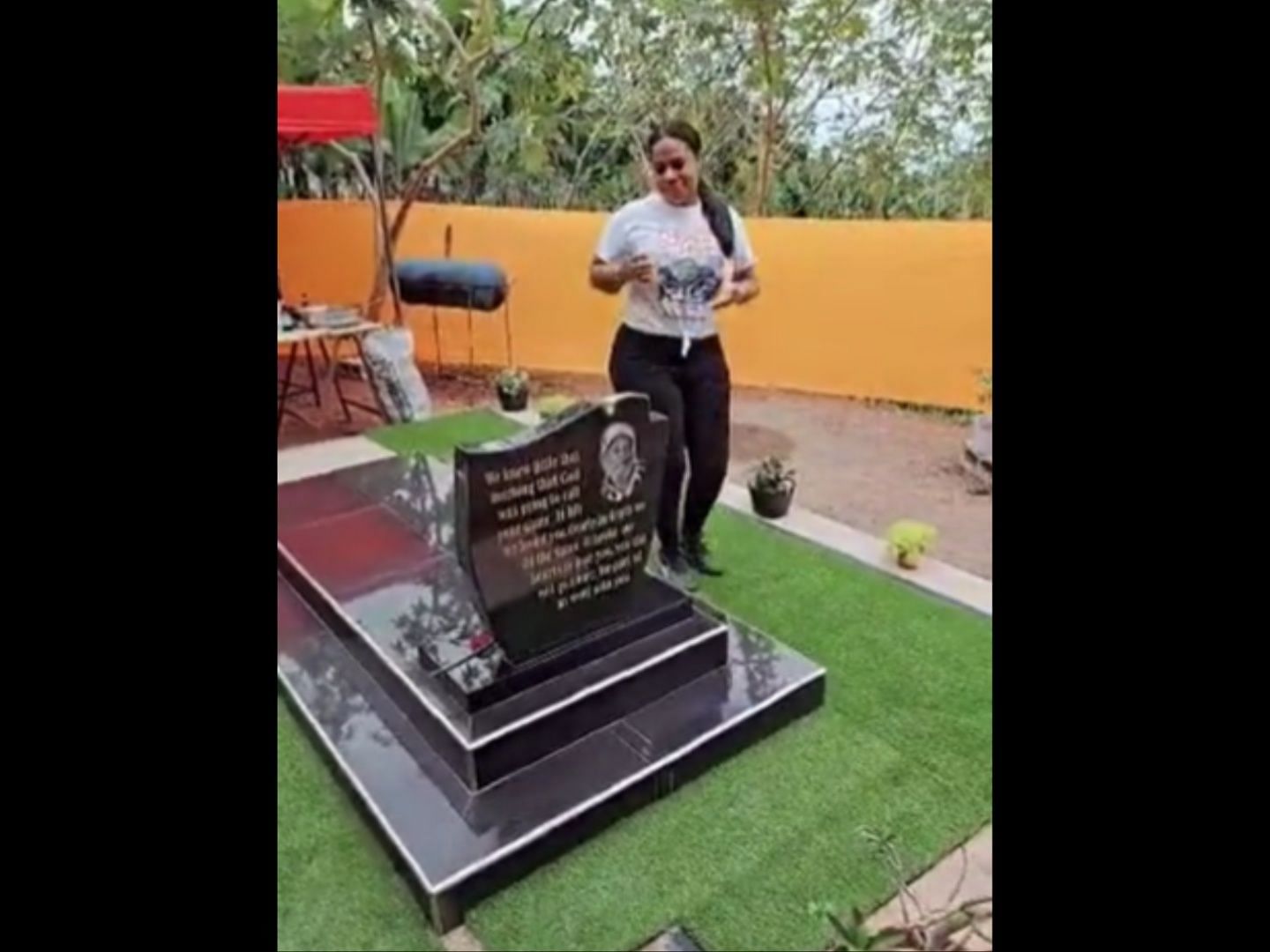 Woman walking around her deceased father&#039;s tombstone in her backyard. (Image via TikTok/@toocuteshanz)