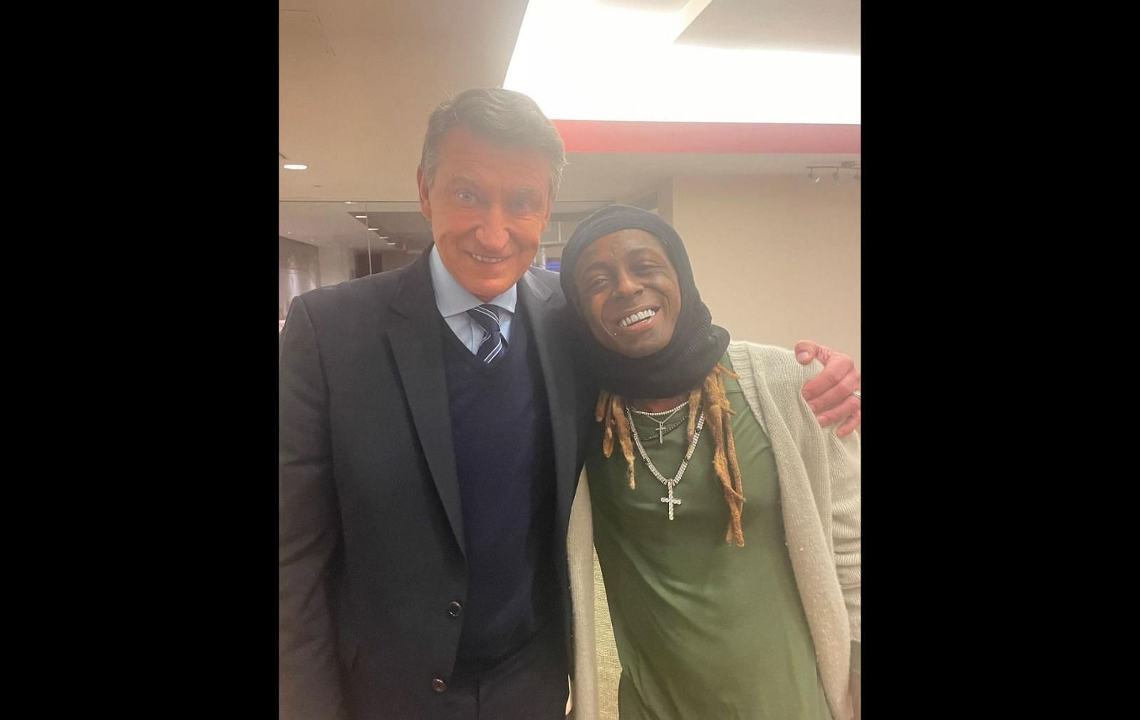 Wayne Gretzky poses with rapper Lil Wayne at Game 4 of Stanley Cup Finals