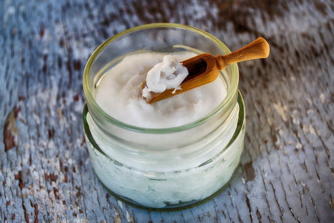 Coconut oil provides deep hydration and imparts a radiant shine to hair. (Dana Tentis/Pexels)