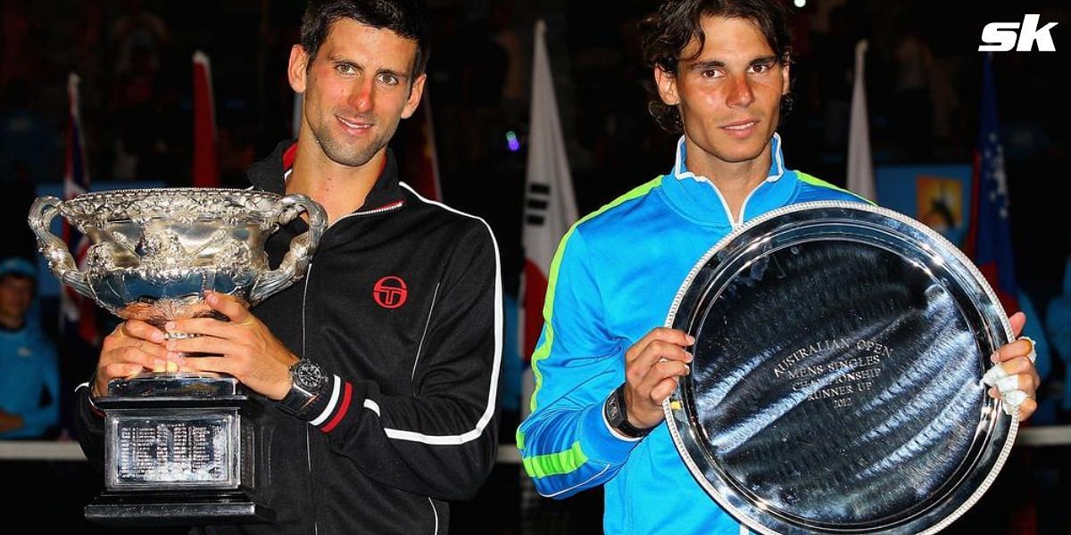 Novak Djokovic and Rafael Nadal with their respective titles at the 2012 Australian Open