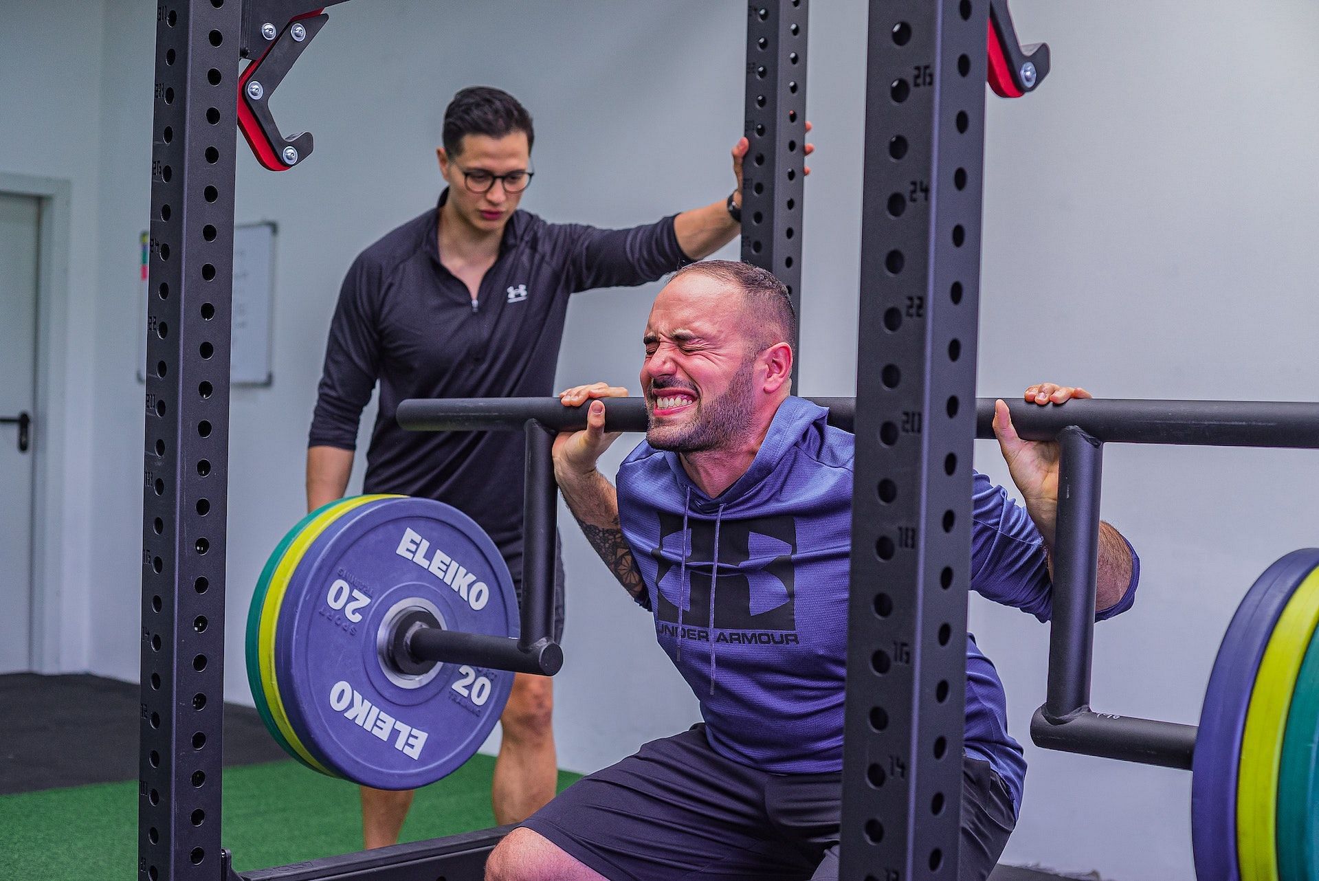 High bar squats build massive lower-body strength. (Photo via Pexels/Justin Luck)