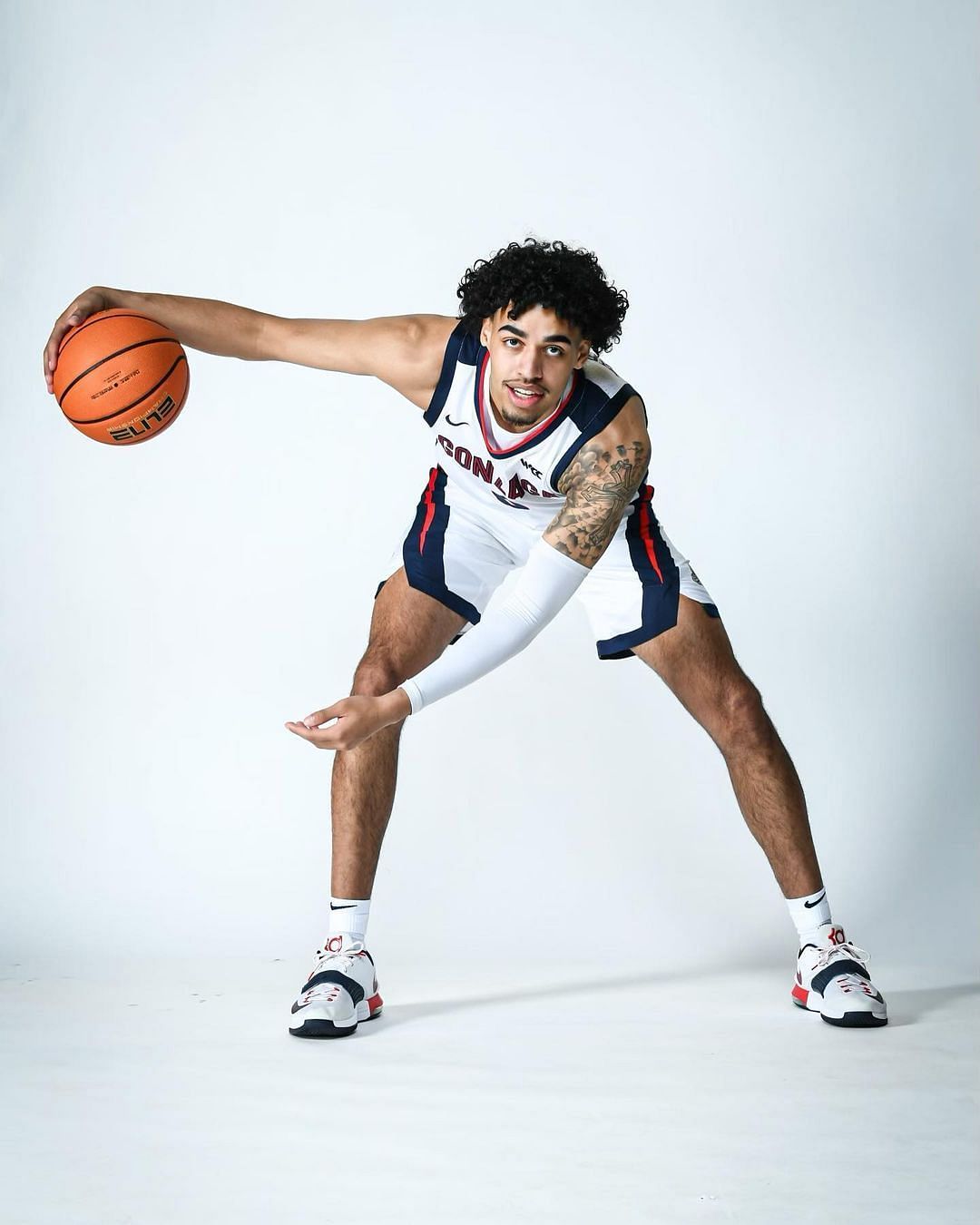 Julian Strawther poses for a photoshoot with a basketball in his hands. Via Instagram.