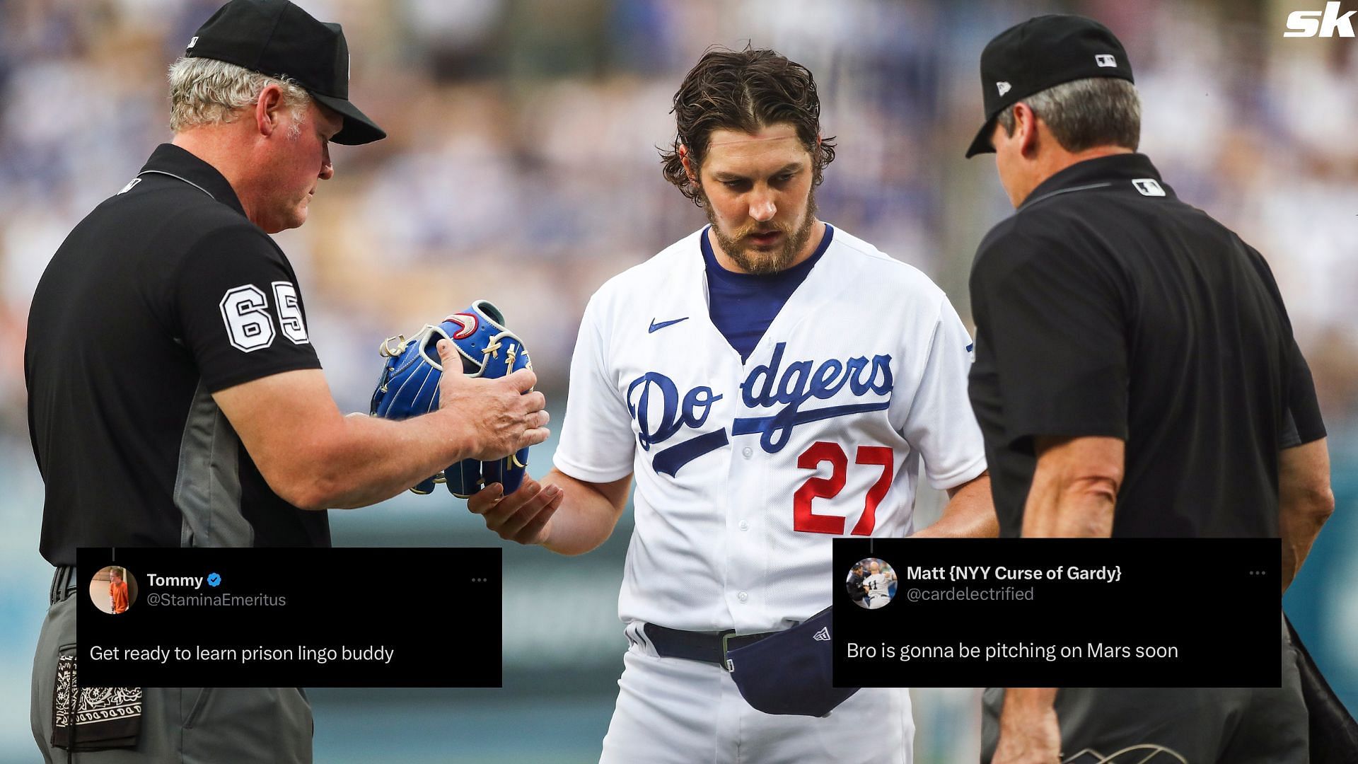 Umpires check the hat and glove of Trevor Bauer of the Los Angeles Dodgers for foreign substances in a MLB game