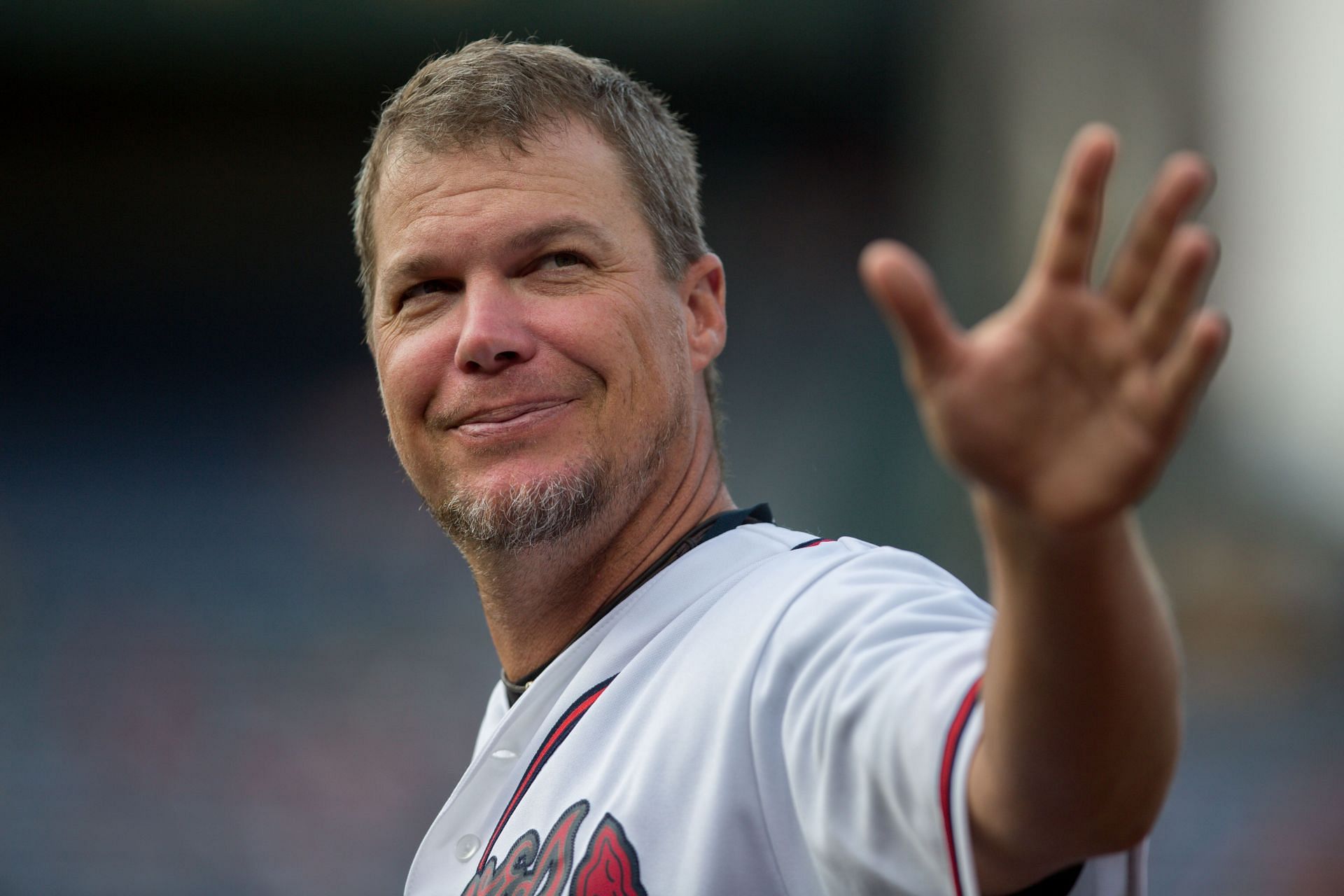 Former Atlanta Braves player Chipper Jones waves to the crowd during a pre-game ceremony honoring many Braves alumni players at Turner Field on August 8, 2014. (Photo by Kevin Liles/Getty Images)