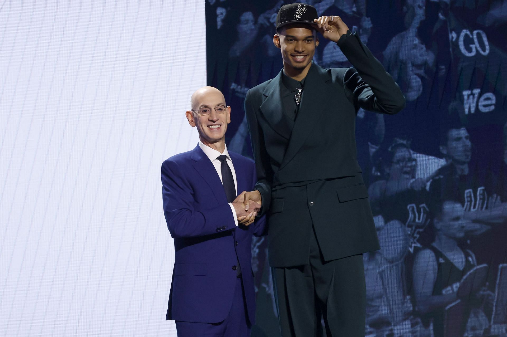 Victor Wembanyama (R) poses with NBA commissioner Adam Silver (L) after being drafted first overall pick by the San Antonio Spurs in the 2023 NBA draft