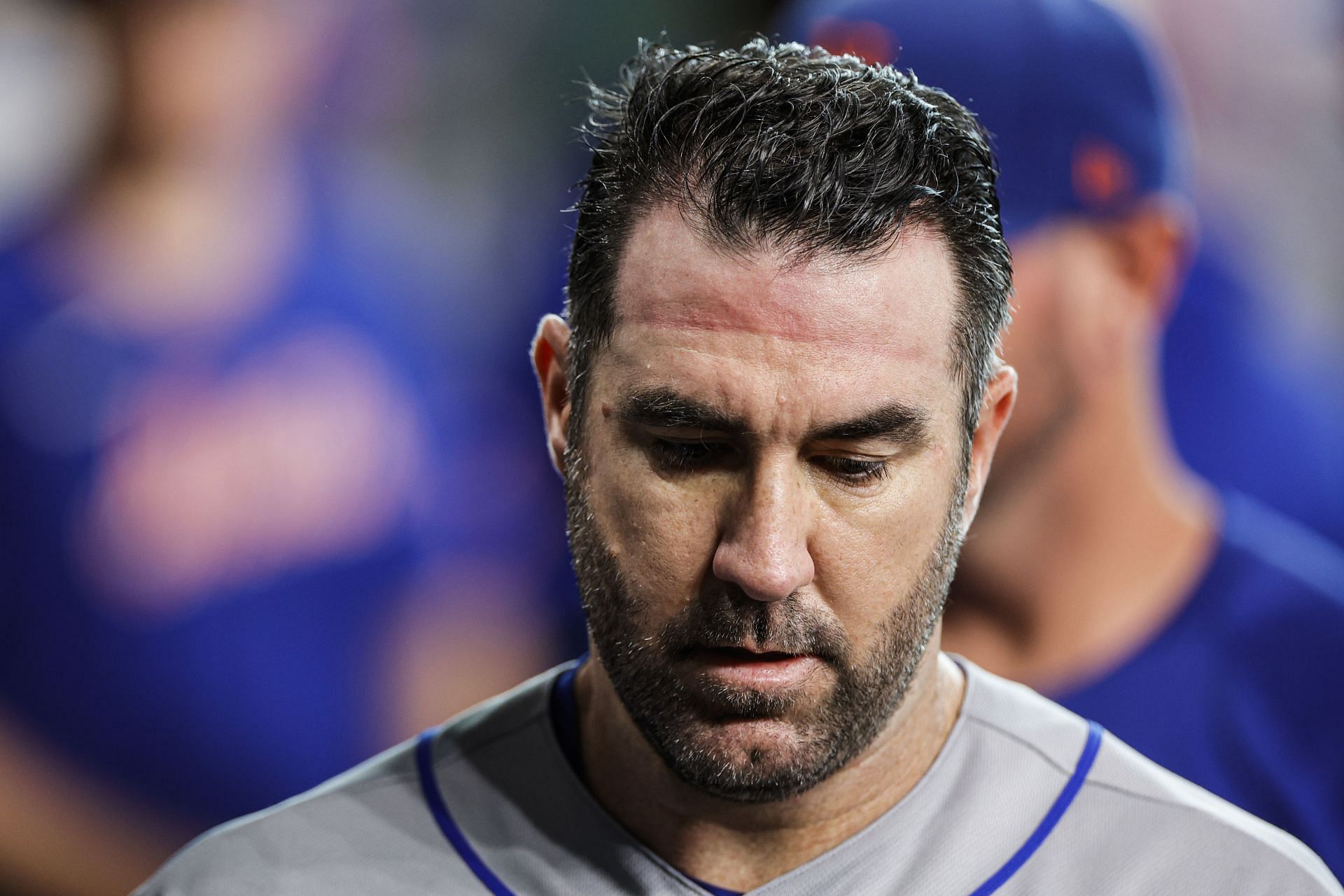 Justin Verlander of the New York Mets walks in the dugout prior to facing the Houston Astros at Minute Maid Park