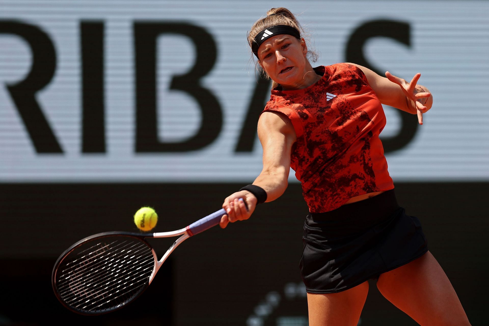 Muchova strikes the ball at the 2023 French Open
